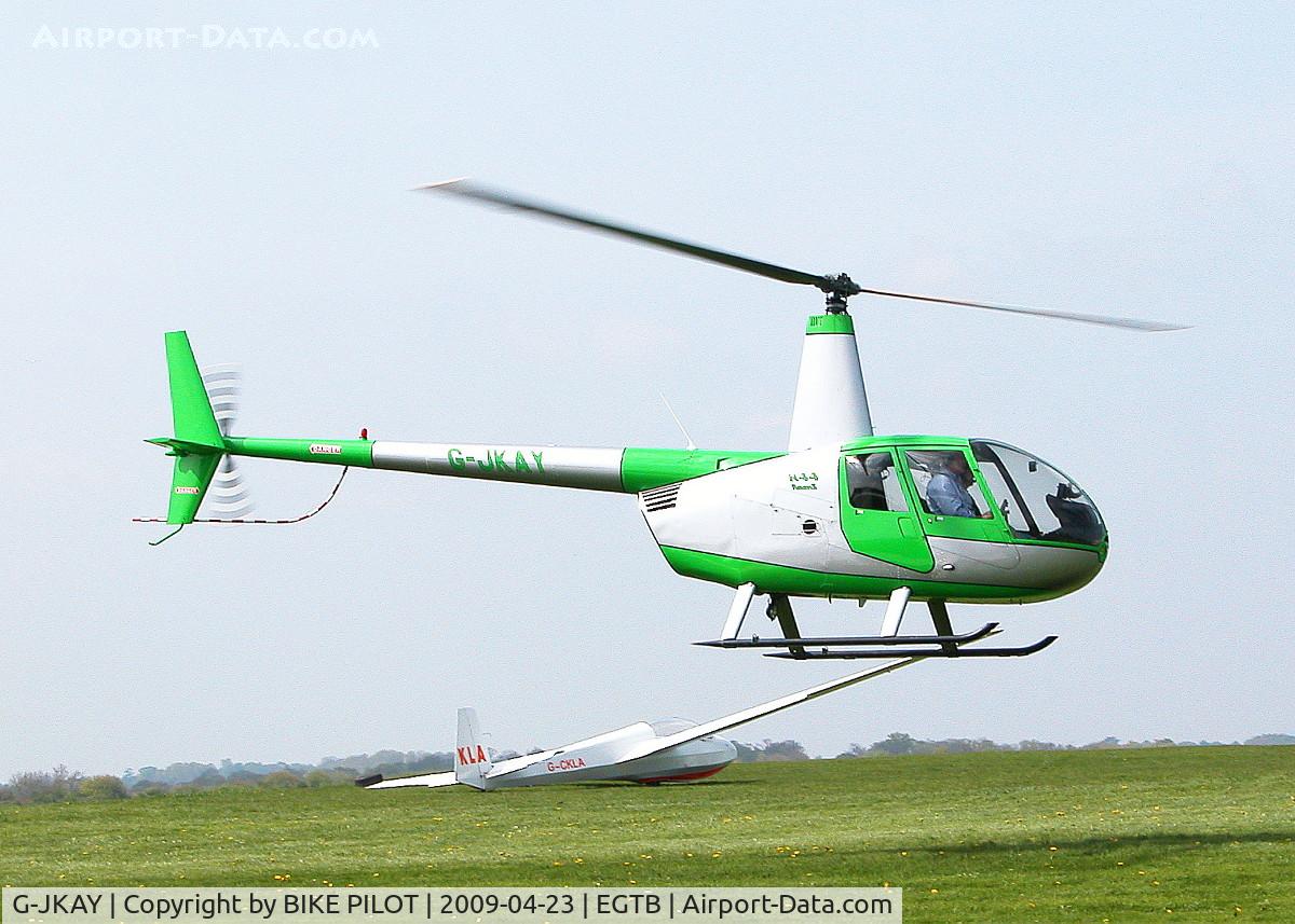 G-JKAY, 2006 Robinson R44 Raven II C/N 11093, FLYING PAST THE RESTAURANT
