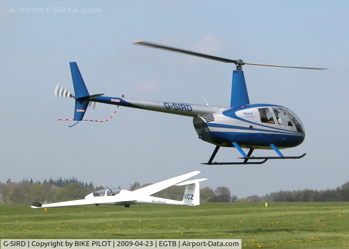 G-SIRD, 2007 Robinson R44 Raven II C/N 11745, FLYING PAST THE RESTAURANT