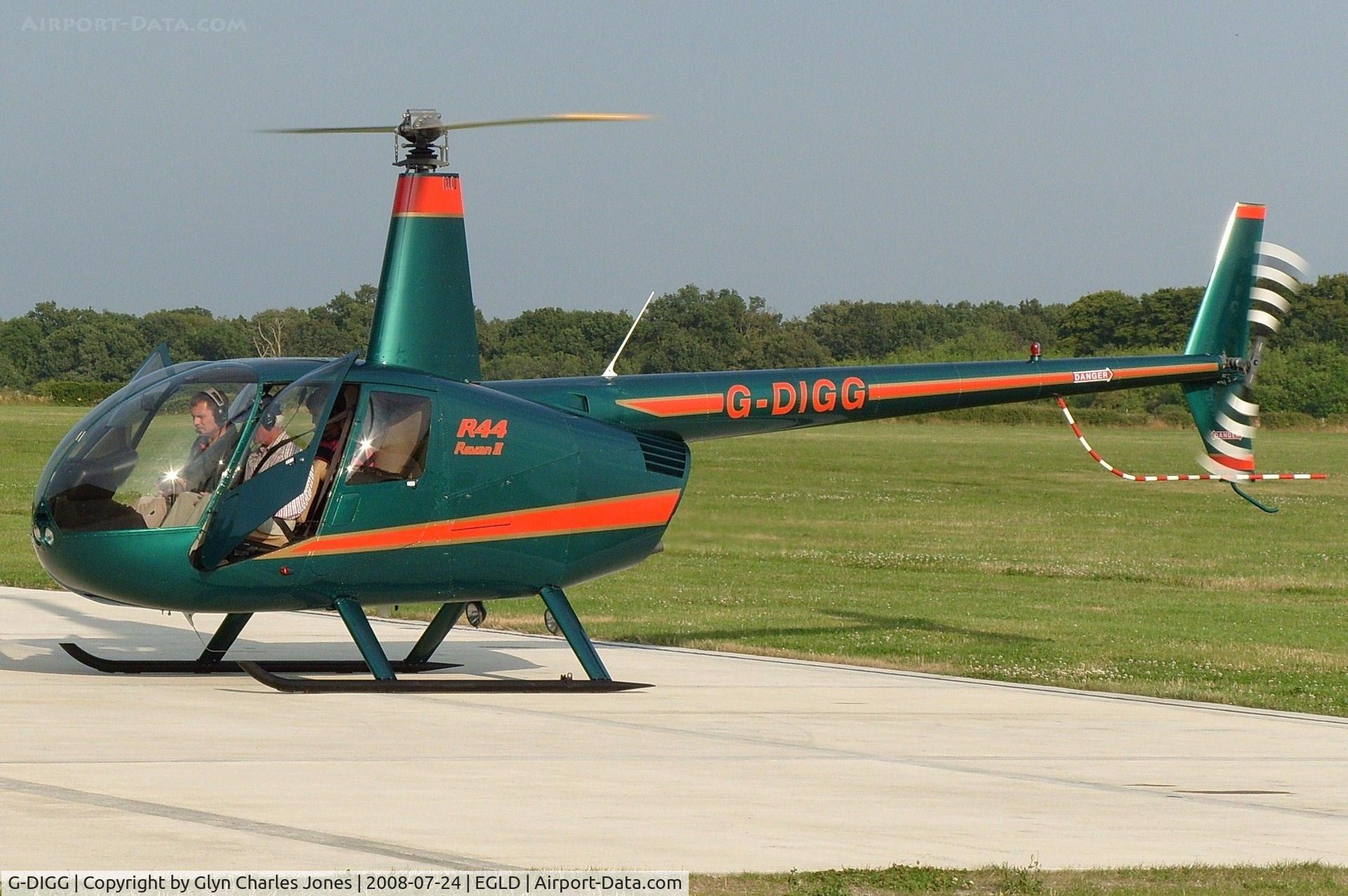 G-DIGG, 2007 Robinson R44 Raven II C/N 11904, Just landed and rotor blades are slowing down. Owned by Thames Materials Ltd.