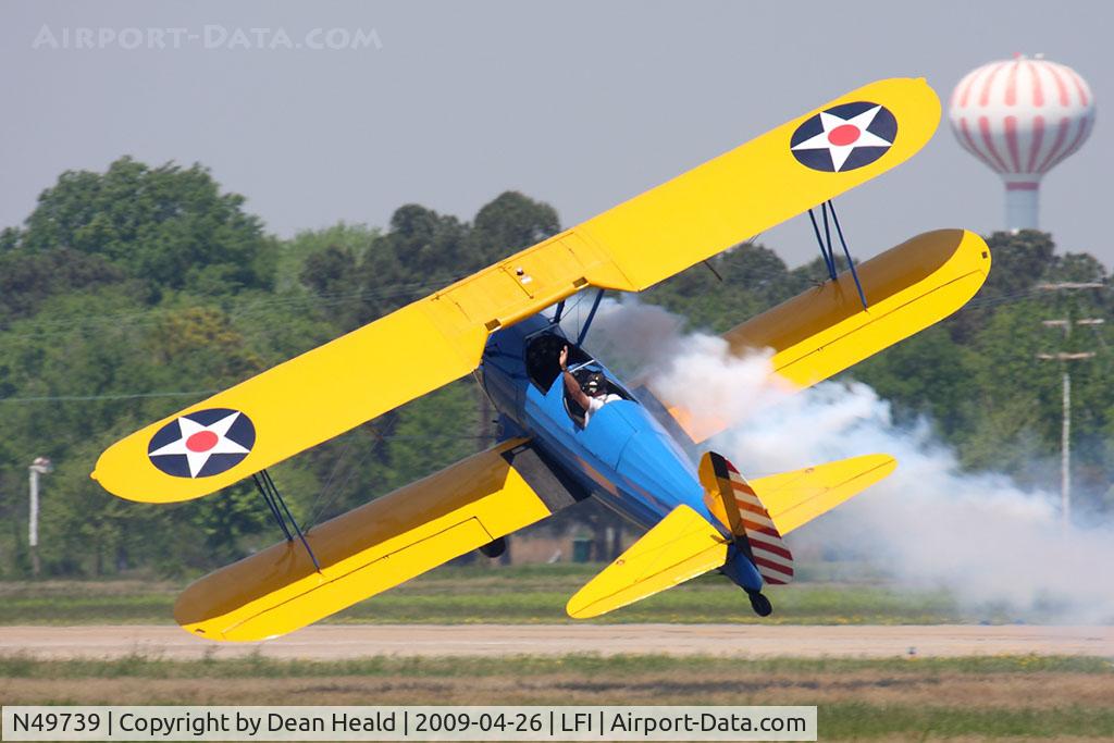 N49739, 1943 Boeing A75N1(PT17) C/N 75-4462, John Mohr slipping his Stearman down the runway just a few feet from the ground and waving to the crowd.