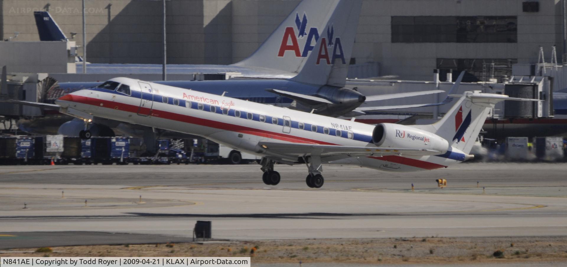 N841AE, 2002 Embraer ERJ-140LR (EMB-135KL) C/N 145667, Departing LAX on 25R