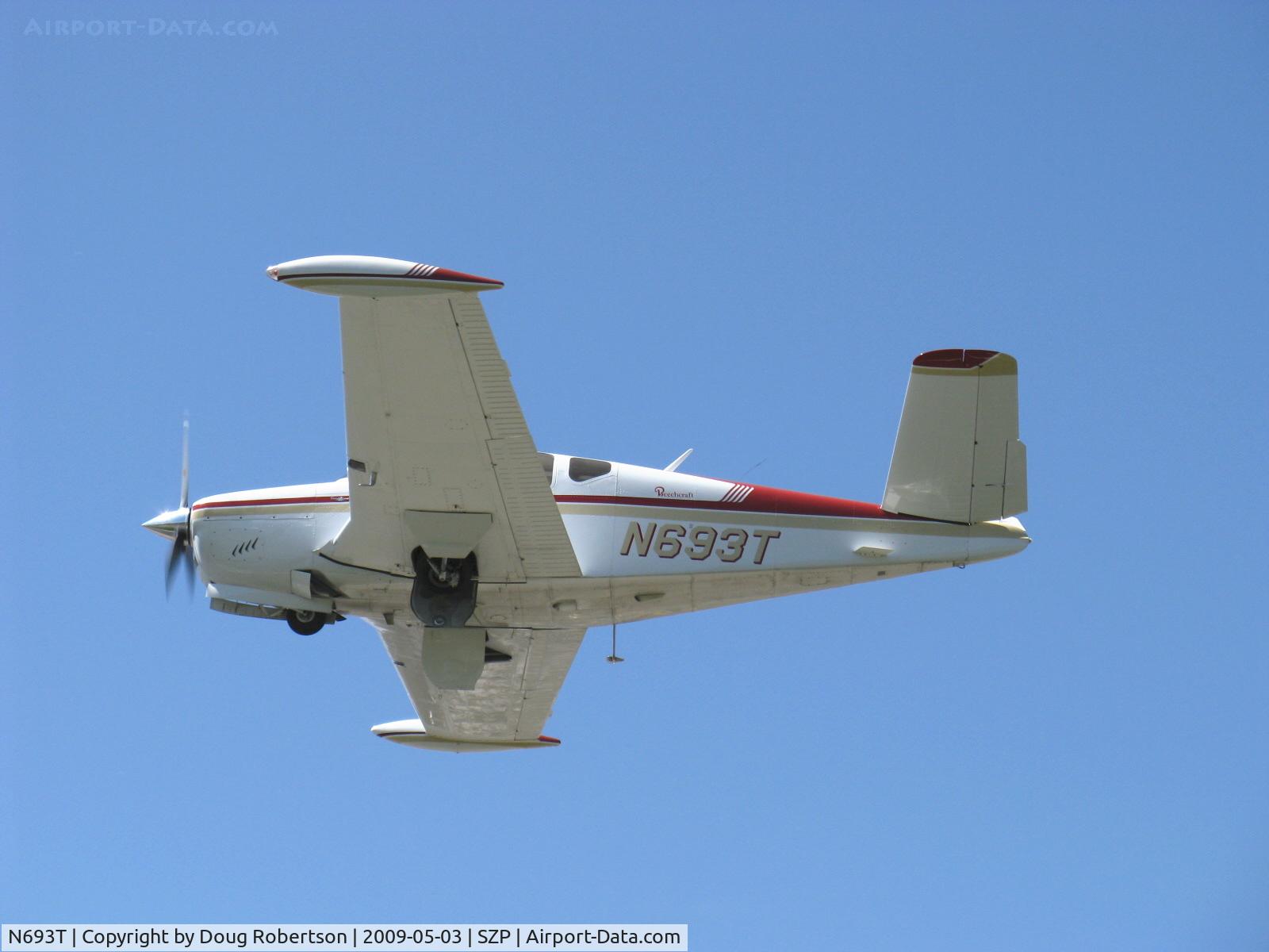 N693T, 1959 Beech K35 Bonanza C/N D-5984, 1959 Beech K35 BONANZA, Continental IO-470-C 250 Hp, 1st Bonanza with 50 gals. std., max speed 210 mph, takeoff climb Rwy 22, gear coming up