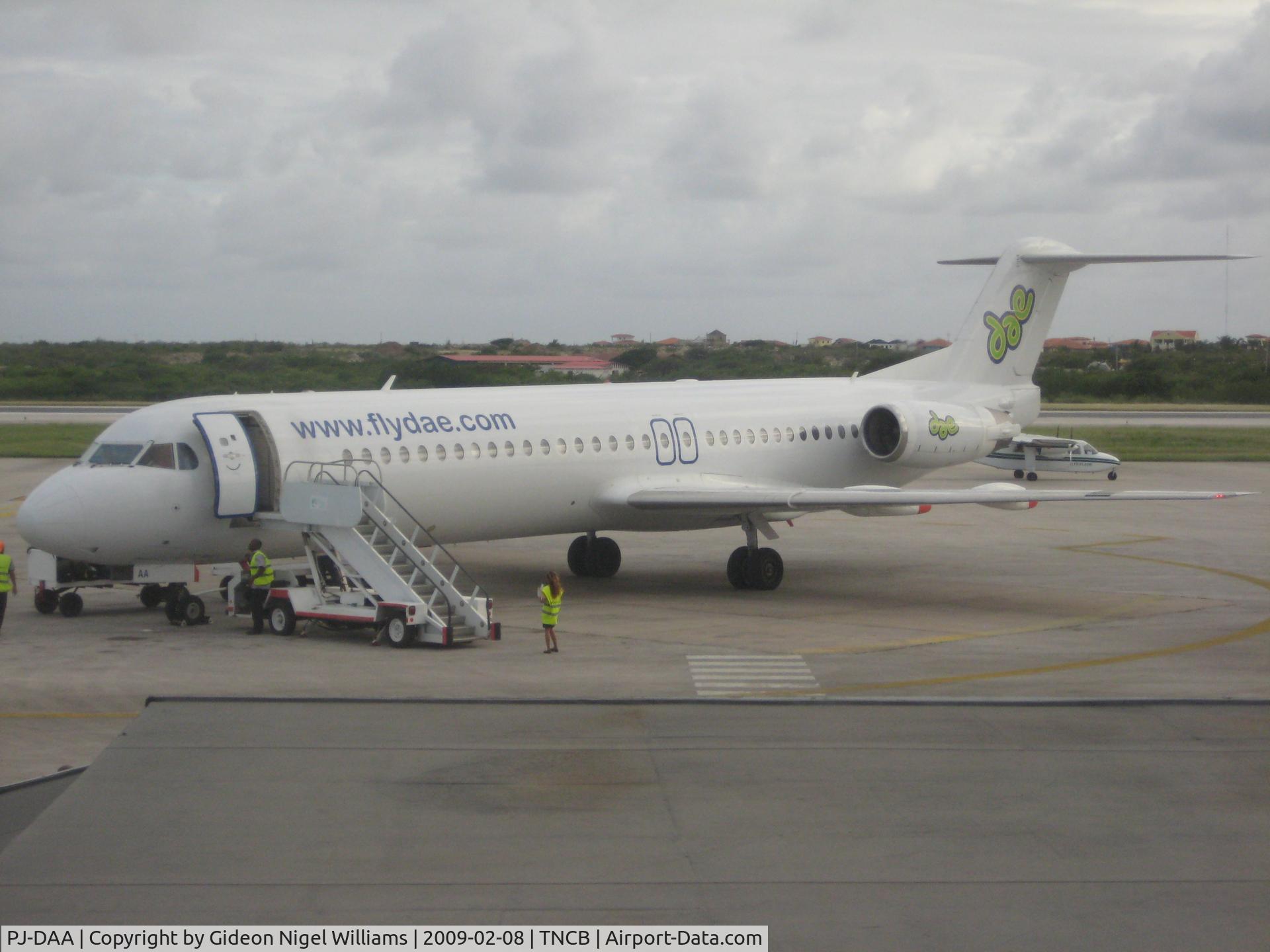 PJ-DAA, 1990 Fokker 100 (F-28-0100) C/N 11310, Note the Divi in the background
