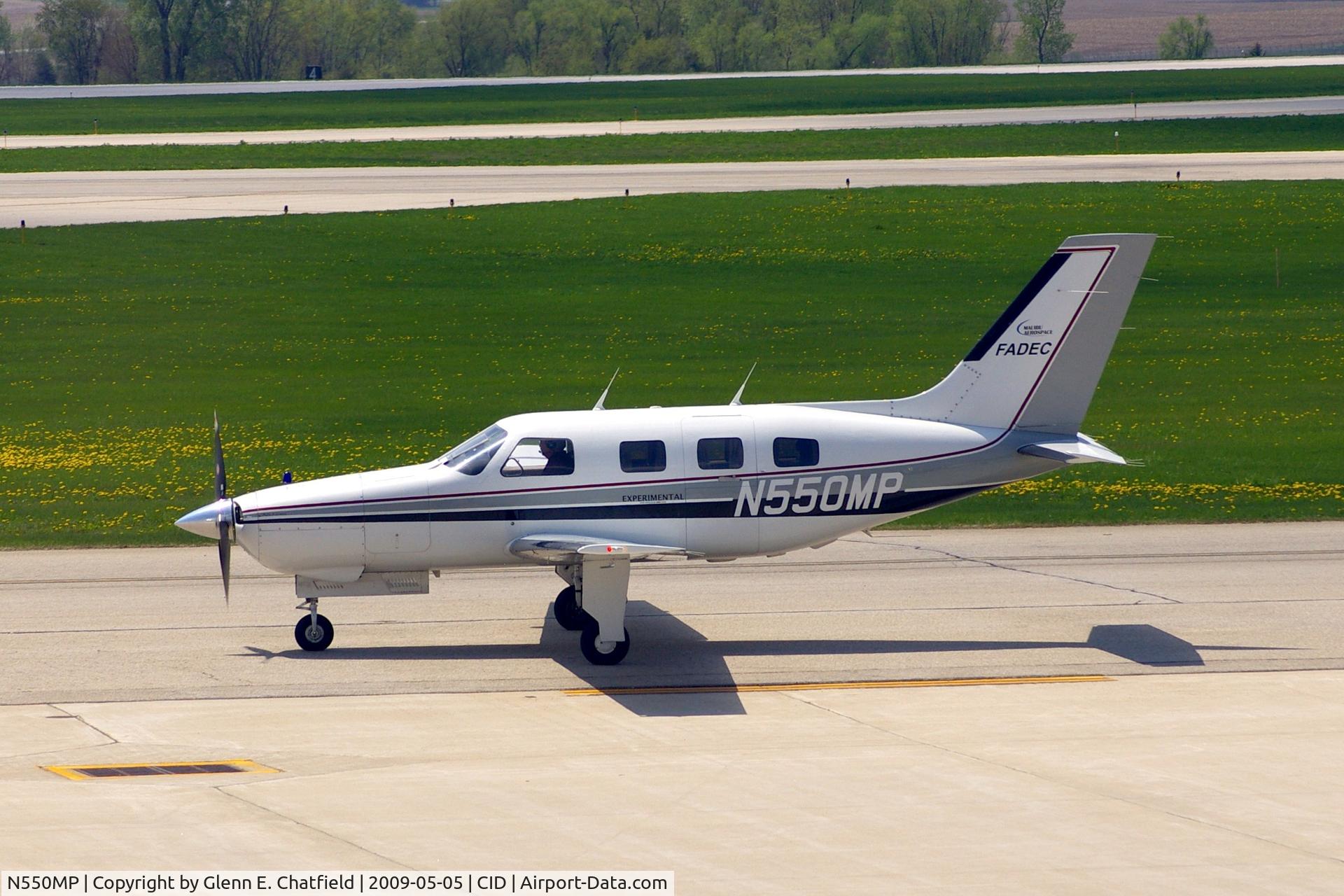 N550MP, 1986 Piper PA-46-310P Malibu C/N 4608041, Taxiing by my window on the way to runway 27.
