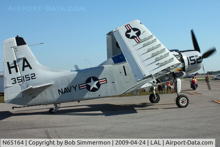 N65164, 1955 Douglas EA-1E Skyraider AD-5W C/N 55-471DH, Unfolding wings for departure at Sun N Fun 2009 - Lakeland, Florida