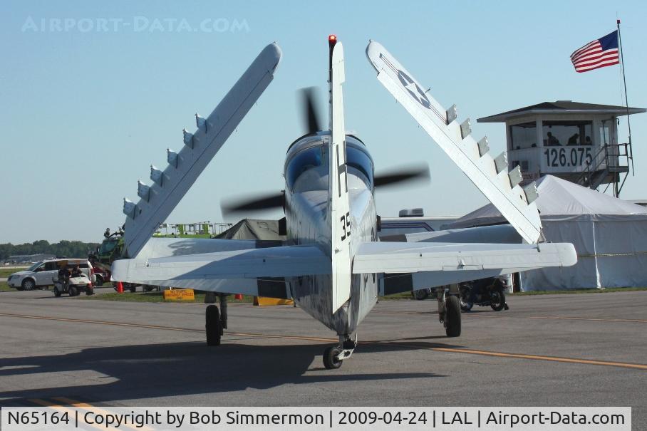 N65164, 1955 Douglas EA-1E Skyraider AD-5W C/N 55-471DH, Unfolding wings for departure at Sun N Fun 2009 - Lakeland, Florida