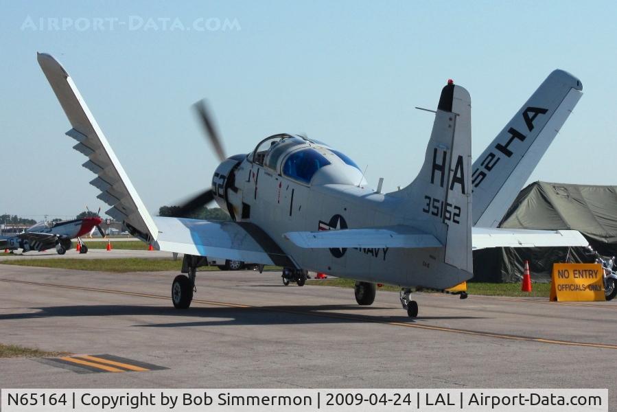 N65164, 1955 Douglas EA-1E Skyraider AD-5W C/N 55-471DH, Unfolding wings for departure at Sun N Fun 2009 - Lakeland, Florida
