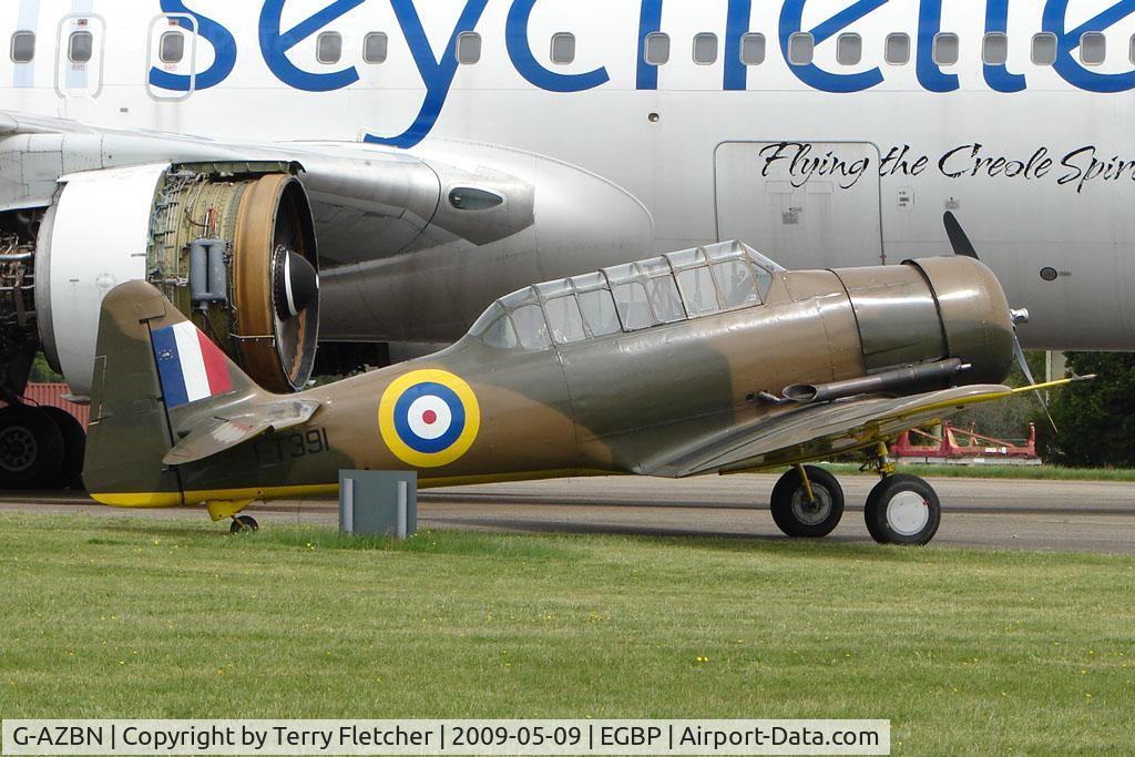 G-AZBN, 1942 Noorduyn AT-16 Harvard IIB C/N 14A-1431, 1942 Noorduyn AT-16 Harvard IIB , FT391 , - dwarfed by Air Seychelles B767 - at Kemble on Great Vintage Flying Weekend