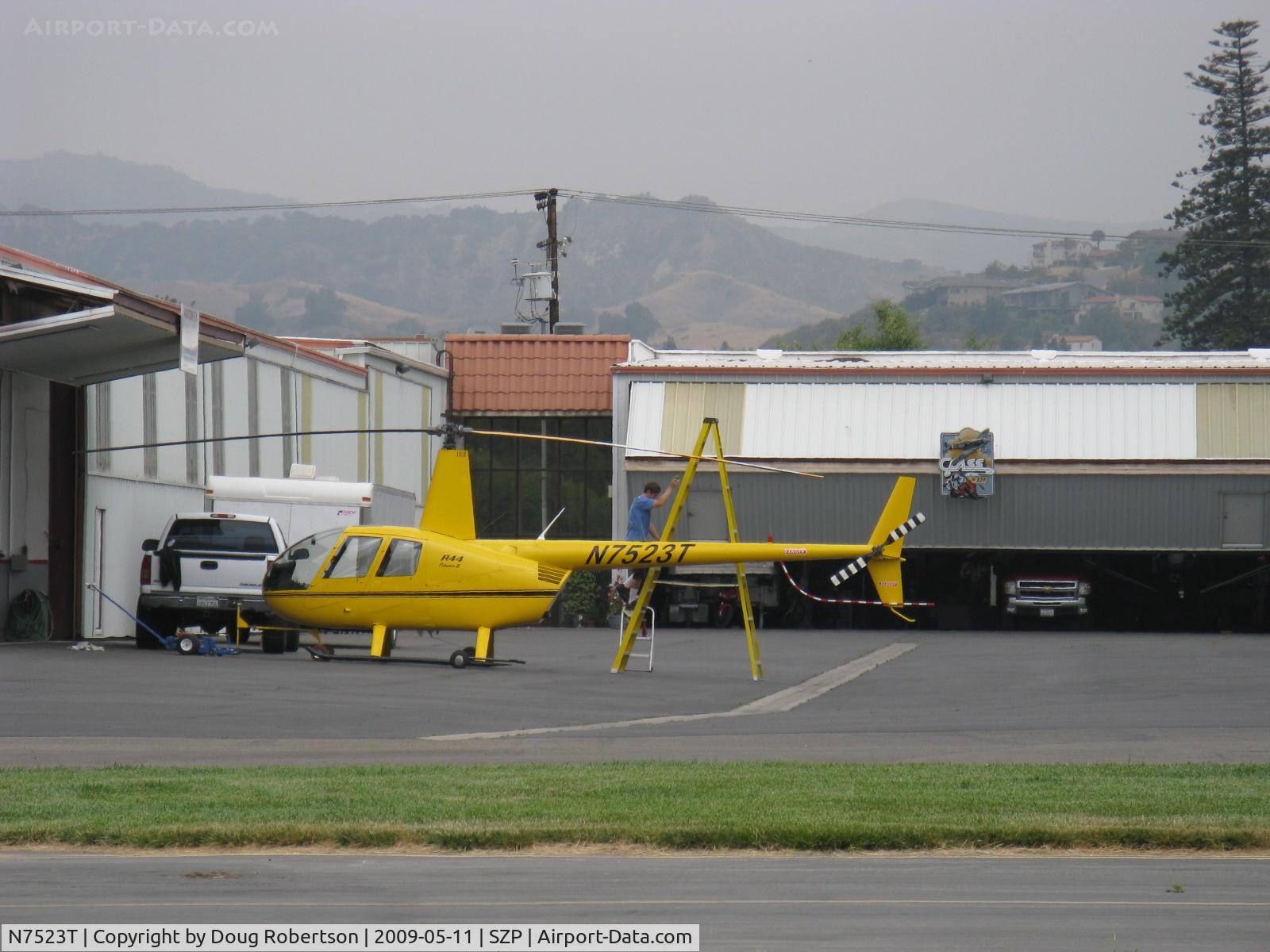 N7523T, 2004 Robinson R44 Raven II C/N 10311, 2004 Robinson R-44 RAVEN II, Lycoming IO-540 derated to 245 Hp for 5 minutes, 205 Hp continuous, cleaning the rotor blades-tall stepladder required