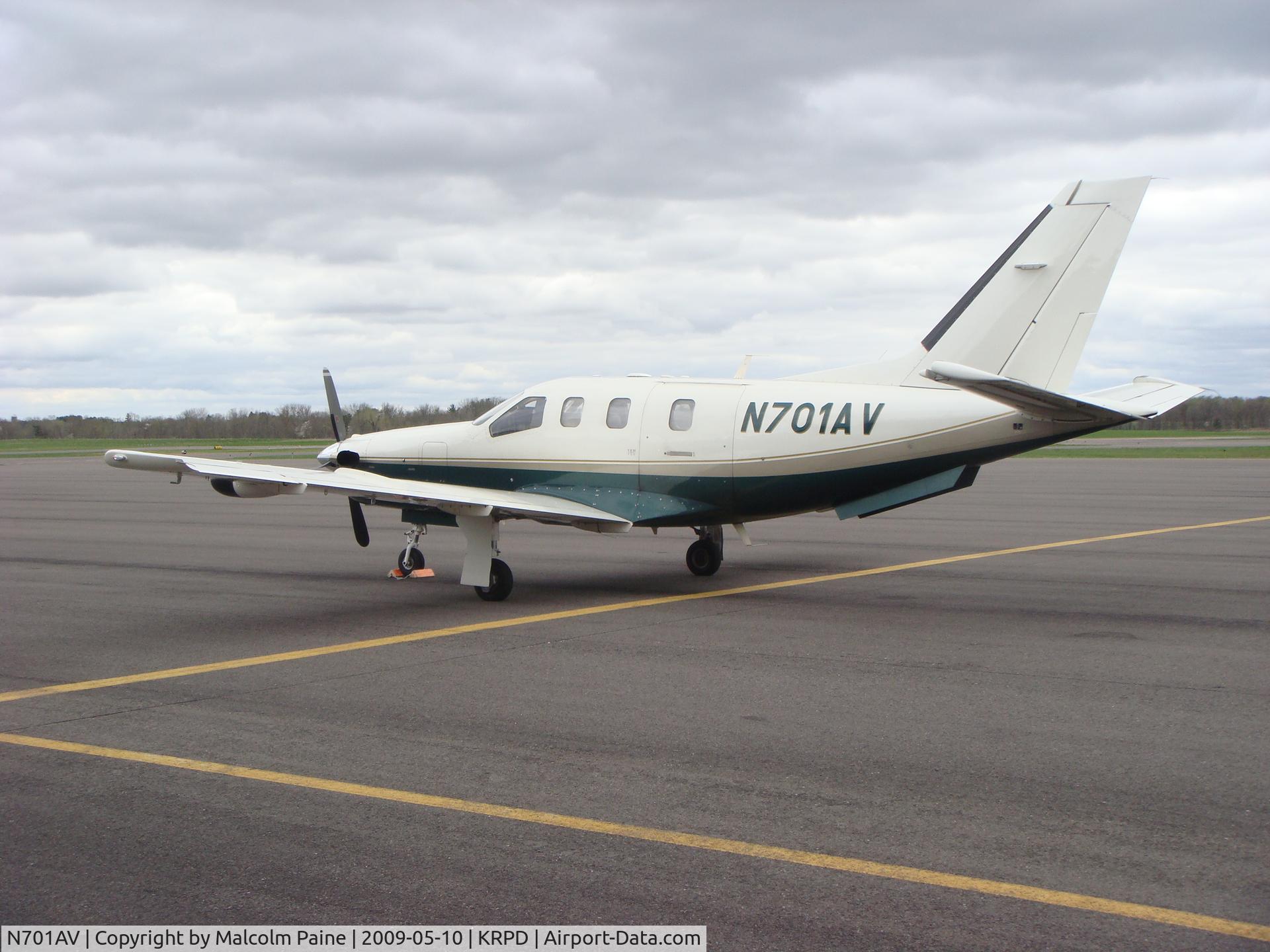 N701AV, 2000 Socata TBM-700 C/N 179, Parked in front of terminal at Rice Lake Regional Airport