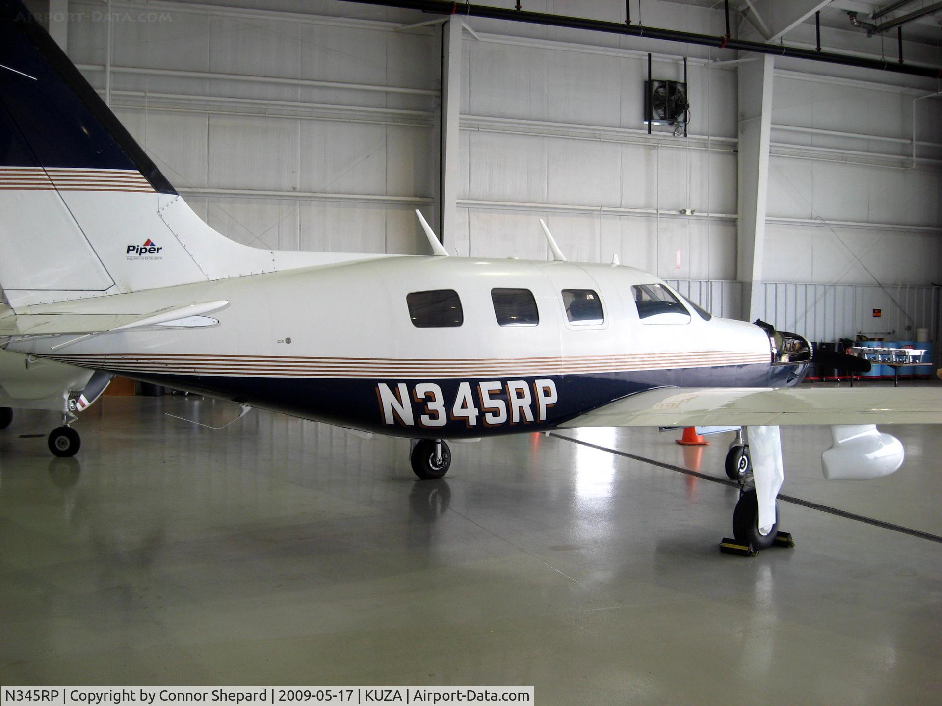 N345RP, 1990 Piper PA-46-350P Malibu Mirage C/N 4622096, Piper in hangar