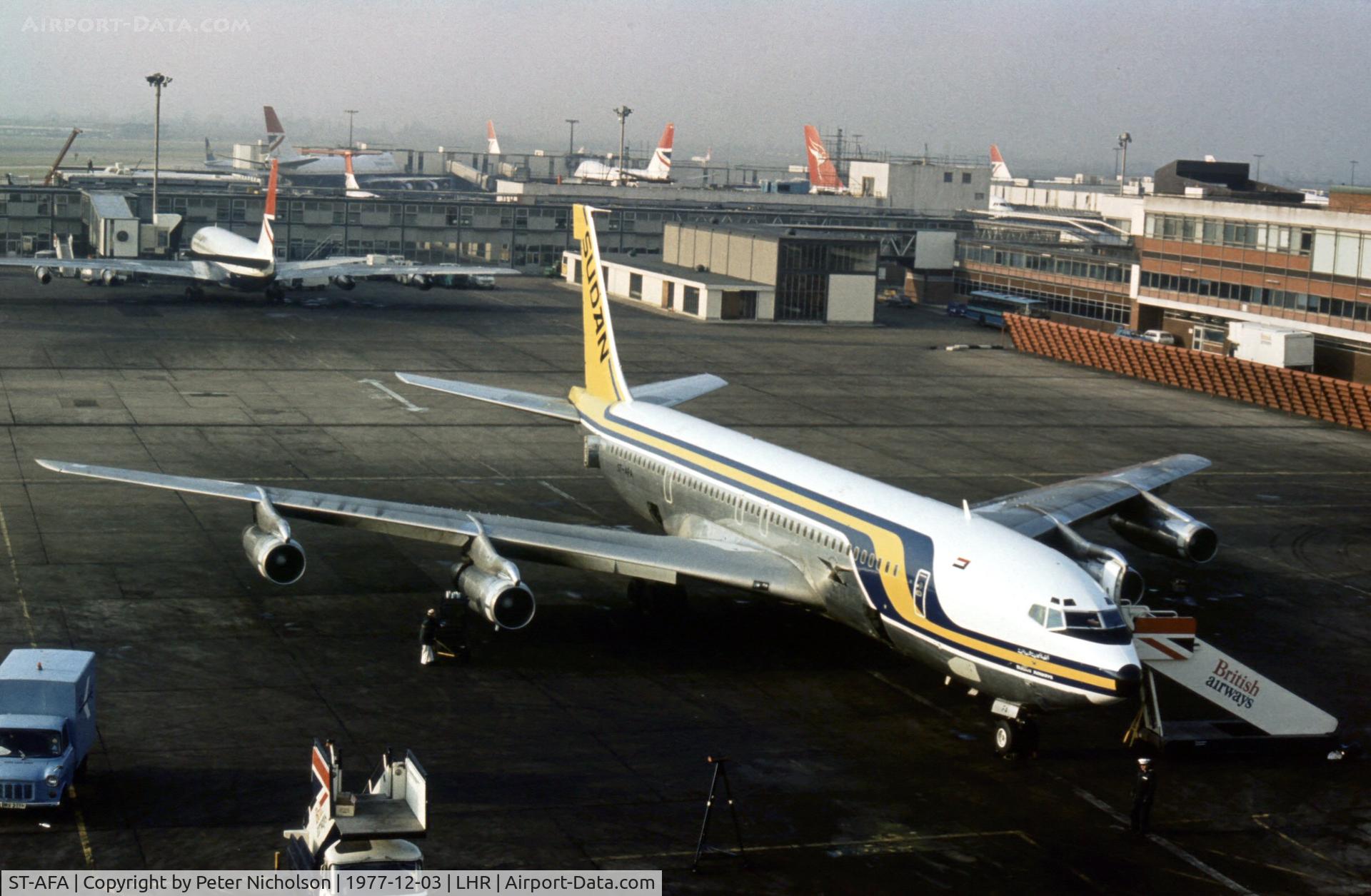 ST-AFA, 1974 Boeing 707-3J8C C/N 20897, Boeing 707 of Sudan Airways at the terminal at Heathrow in December 1977.
