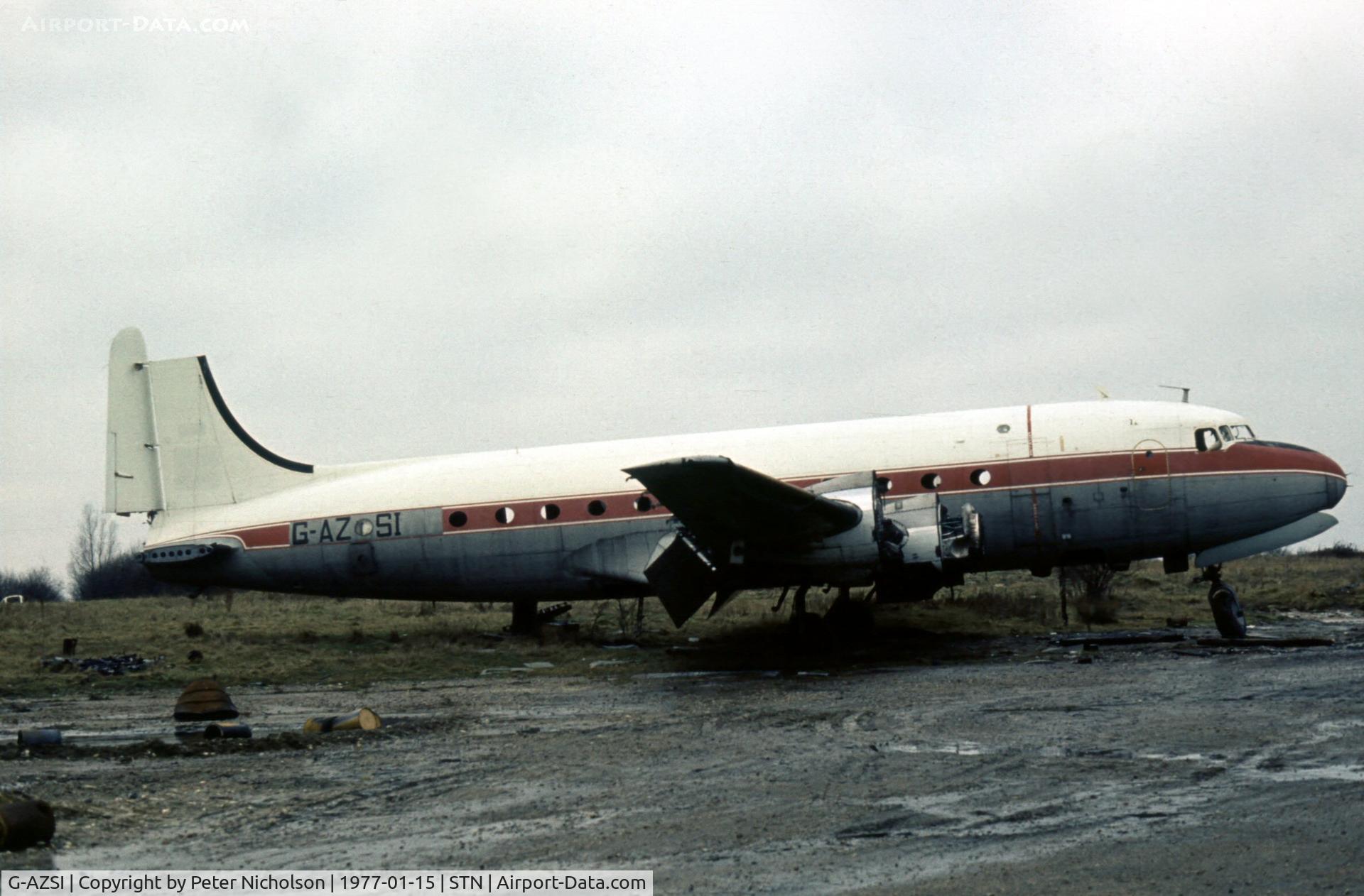 G-AZSI, 1946 Douglas DC-4 Skymaster C/N 42987, DC-4 in the Civil Aviation Authority Fire Training School's compound at Stansted in January 1977.