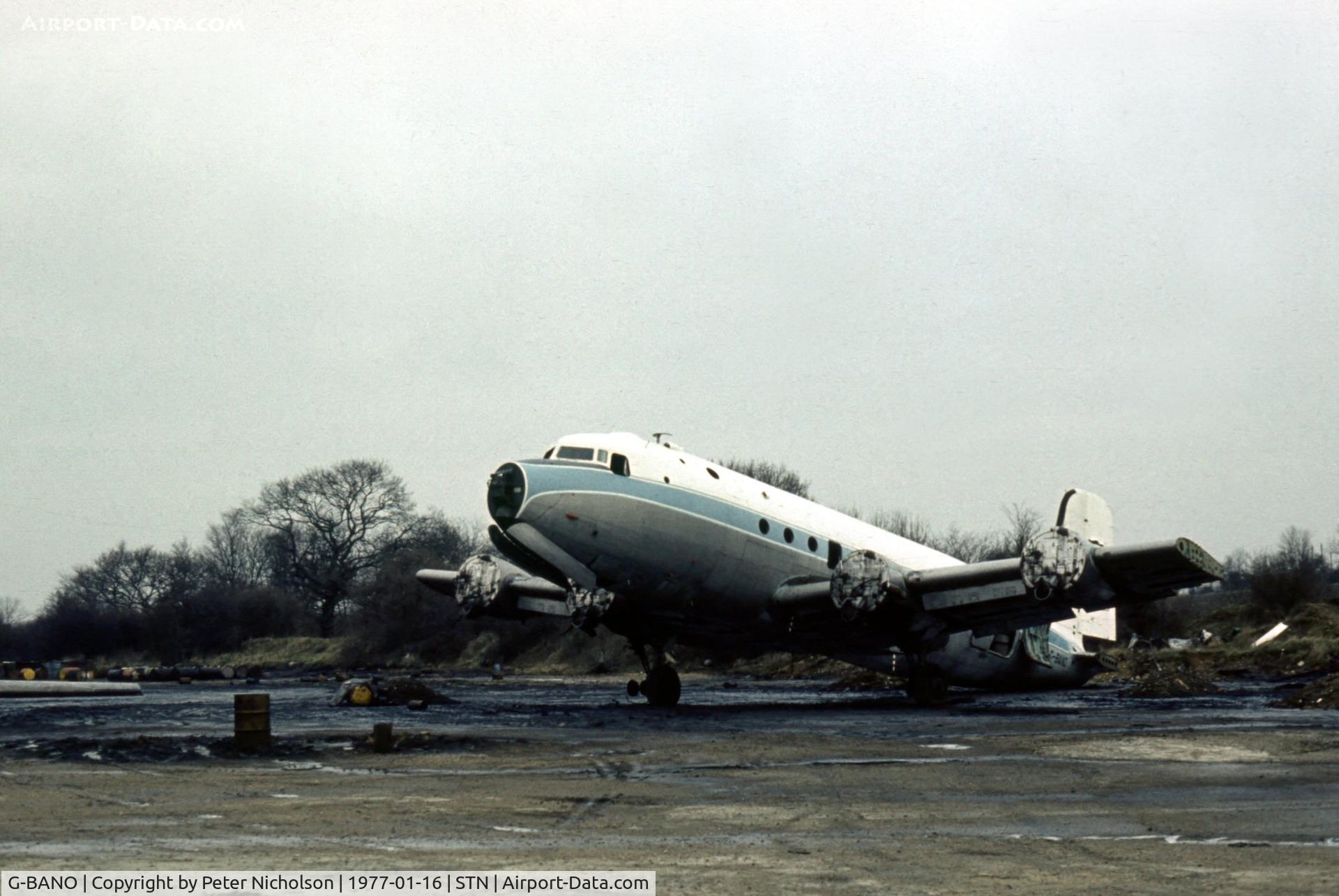 G-BANO, 1946 Douglas DC-4 Skymaster C/N 42988, DC-4 in the Civil Aviation Authority Fire Training School's compound at Stansted in January 1977.
