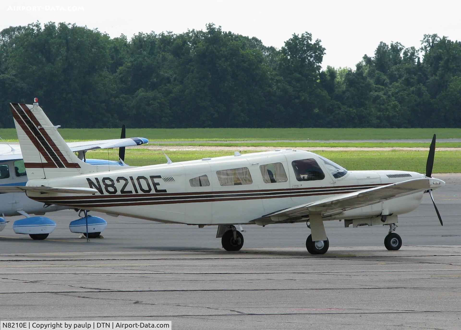 N8210E, 1982 Piper PA-32R-301T Turbo Saratoga SP Saratoga C/N 32R-8229053, At Downtown Shreveport. The trees are green in this one.