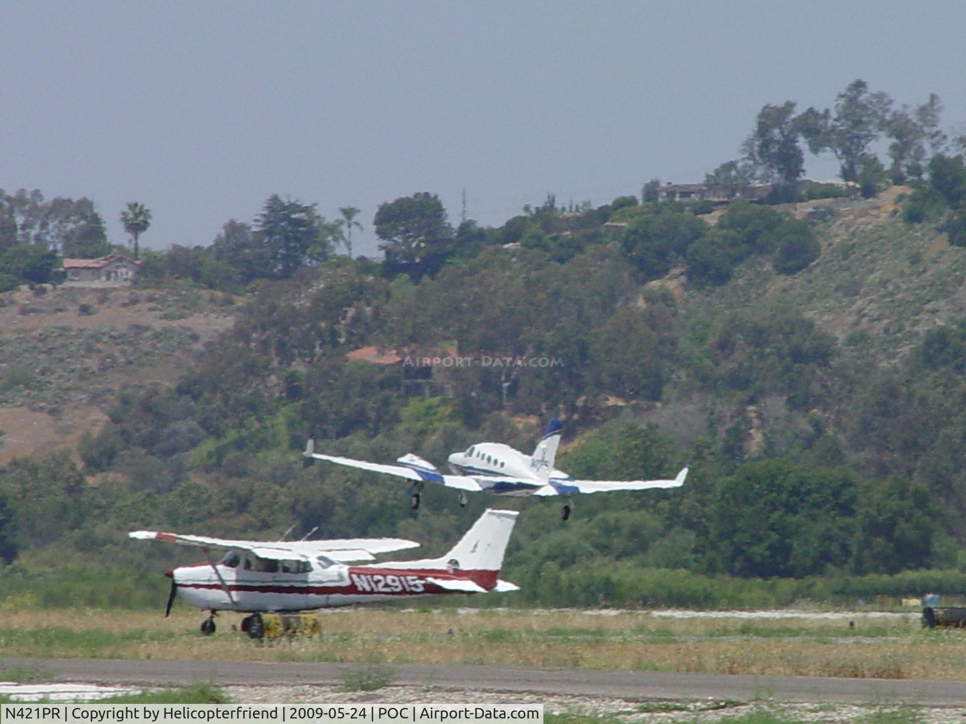 N421PR, 1975 Cessna 421C Golden Eagle C/N 421C-0027, Getting airbourne after passing N12915 who was waiting for clearence to taxi back to 26L