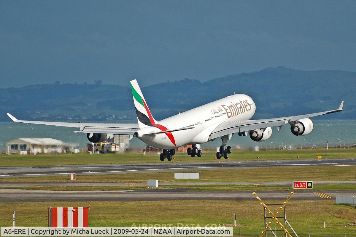 A6-ERE, 2004 Airbus A340-541 C/N 572, Touching down just before the next heavy rain shower...