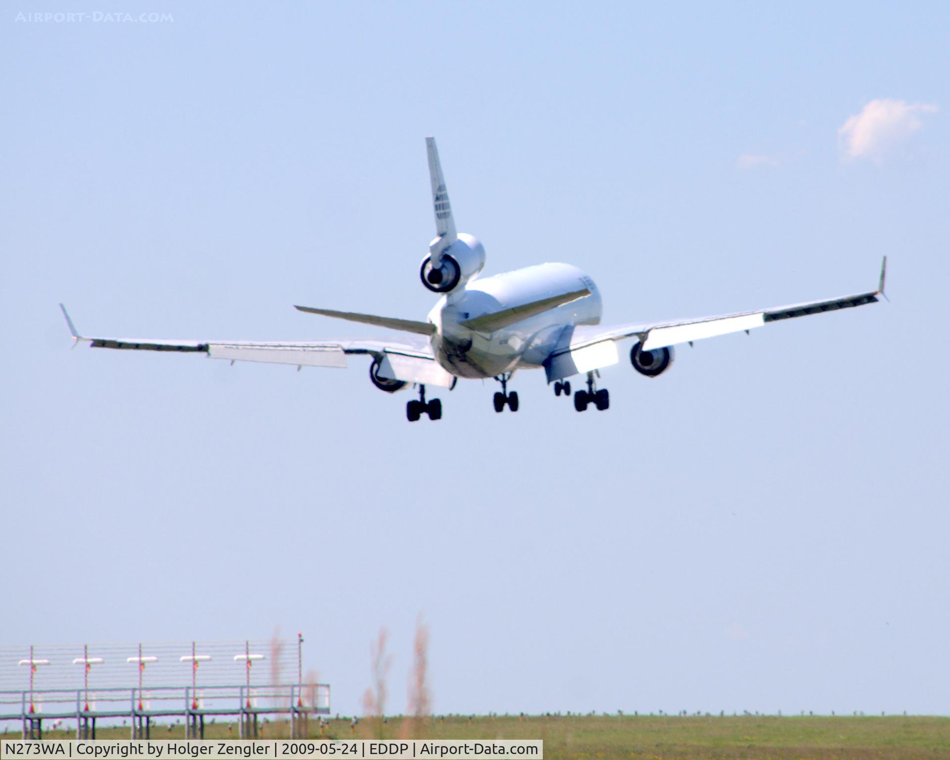 N273WA, 1993 McDonnell Douglas MD-11 C/N 48519, View through the eastern airport fence of LEJ