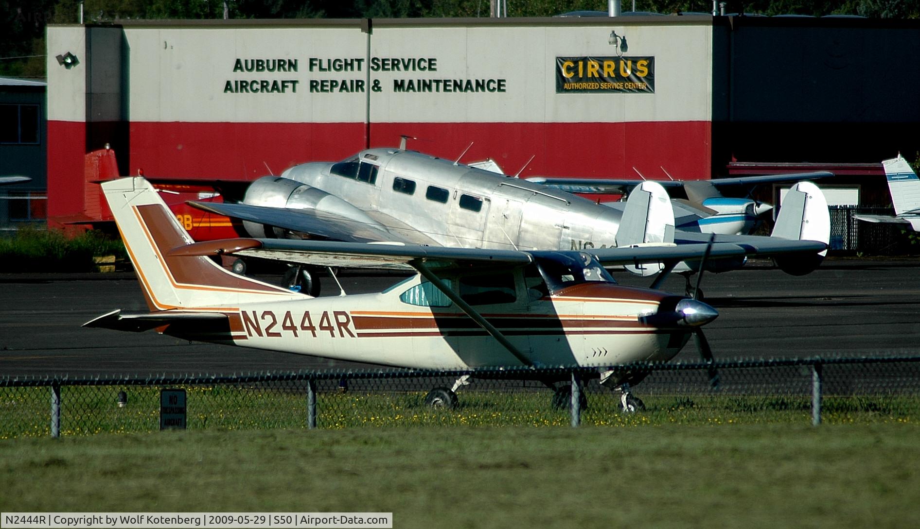 N2444R, 1964 Cessna 182G Skylane C/N 18255544, Rolling past a twin Beech N6495D