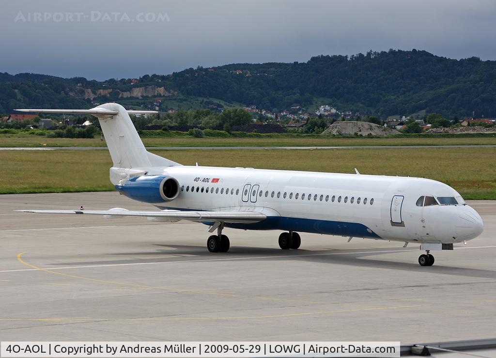 4O-AOL, 1989 Fokker 100 (F-28-0100) C/N 11268, Mixed livery.