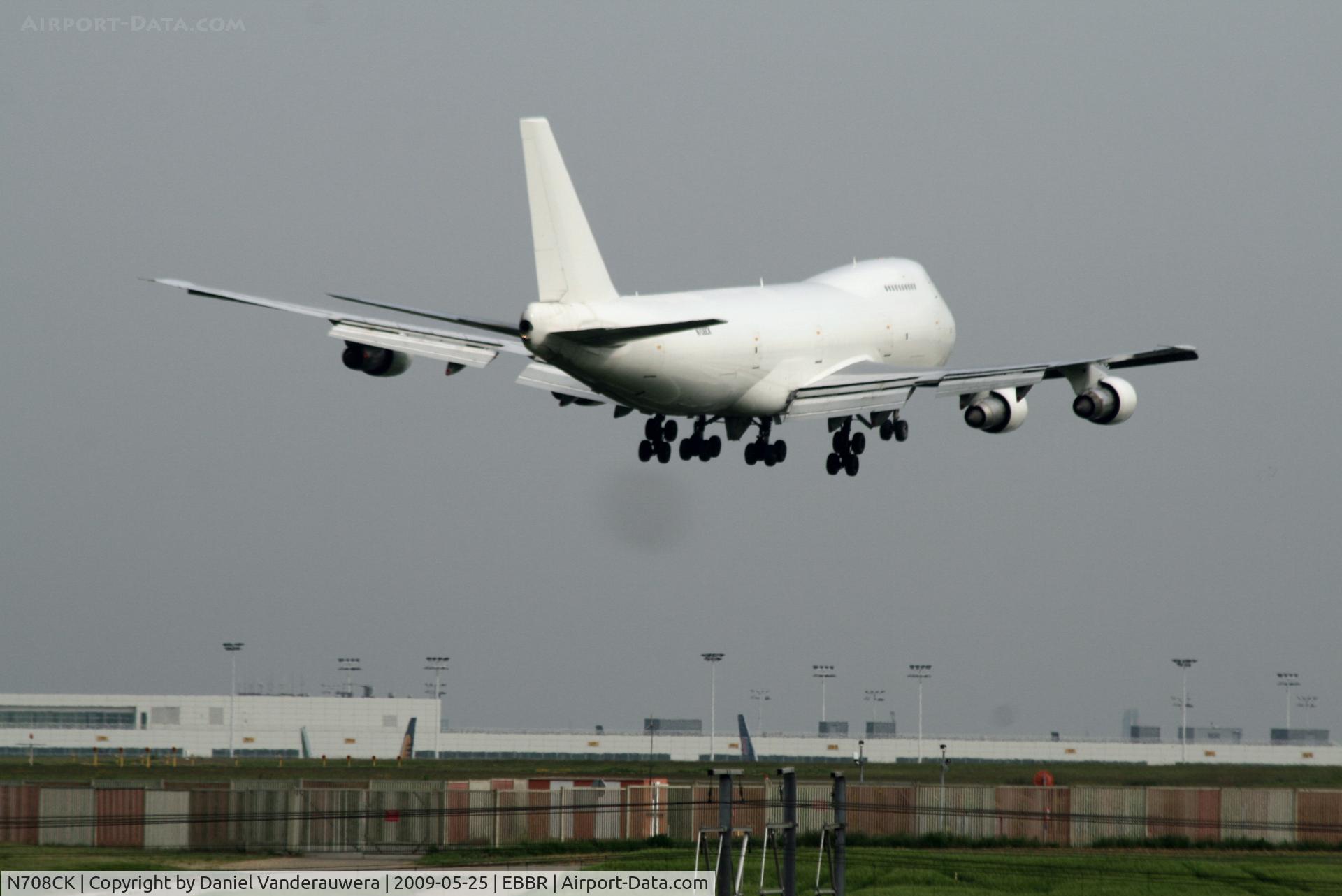 N708CK, 1980 Boeing 747-212B C/N 21937, several seconds before landing on rwy 02 - black spot under a/c is an insect