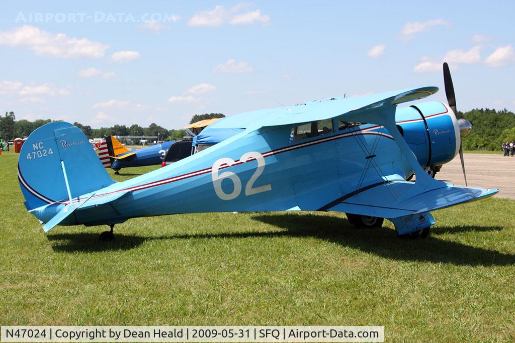 N47024, 1928 Beech C17B C/N C17B-102, 1936 Beechcraft C17B Staggerwing NC47024 at the 2009 Virginia Regional Festival of Flight at Suffolk Executive Airport. Seen here in the Olive Ann Beech and Louise Thaden colors, based on the 1936 Sherwin-Williams Airplane Finishing specifications.