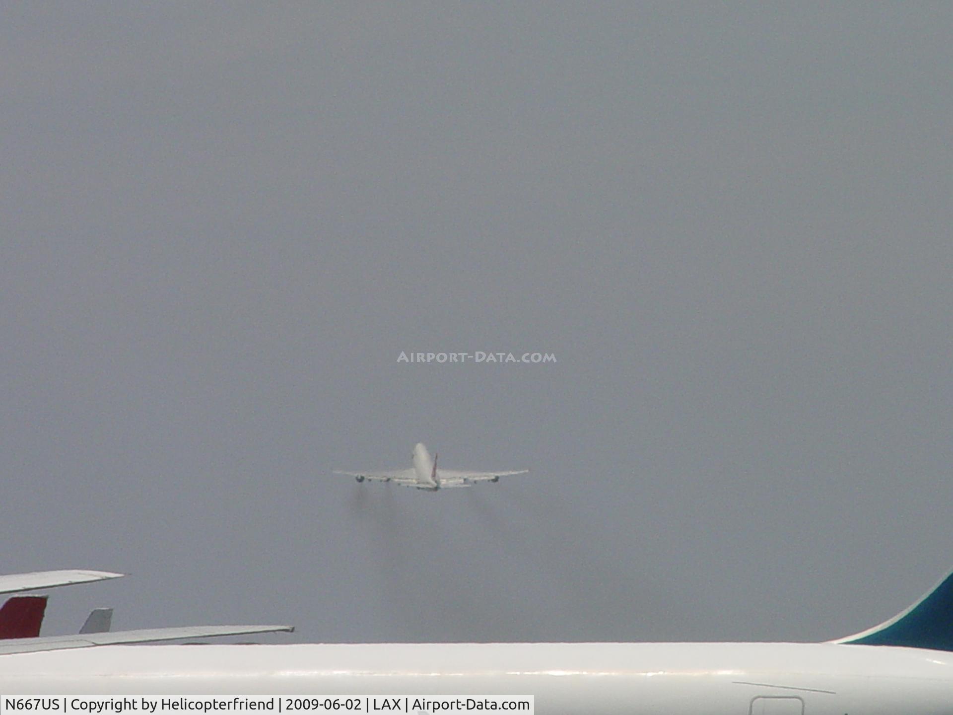 N667US, 1990 Boeing 747-451 C/N 24222, Airbourne and heading out over the Pacific Ocean