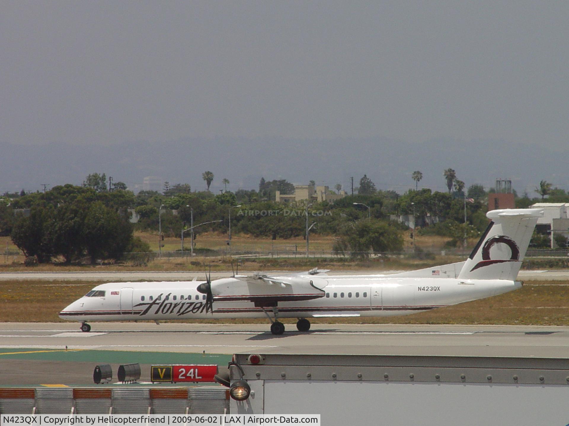 N423QX, 2007 Bombardier DHC-8-402 Dash 8 C/N 4153, Rolling westbound on 24L