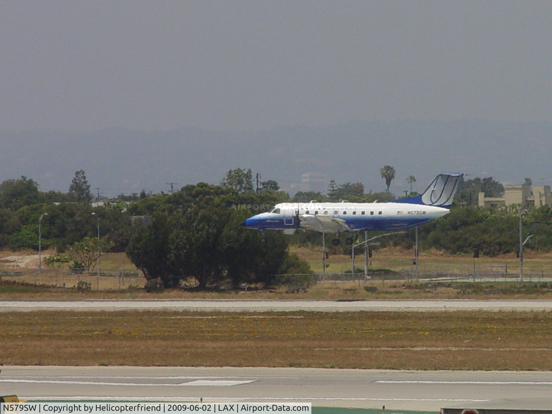 N579SW, 1998 Embraer EMB-120ER Brasilia C/N 120347, Settling down for Runway 24R