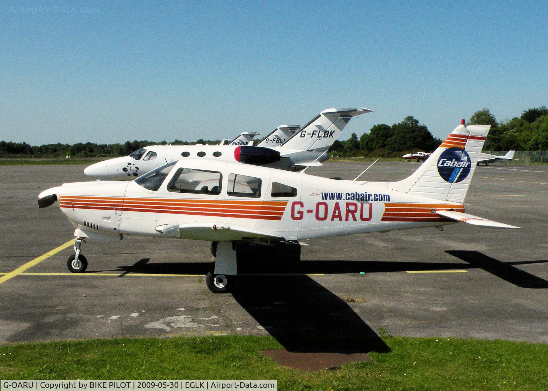 G-OARU, 1989 Piper PA-28R-201 Cherokee Arrow III C/N 2837026, VISITING CABAIR PA-28 ON THE TERMINAL APRON