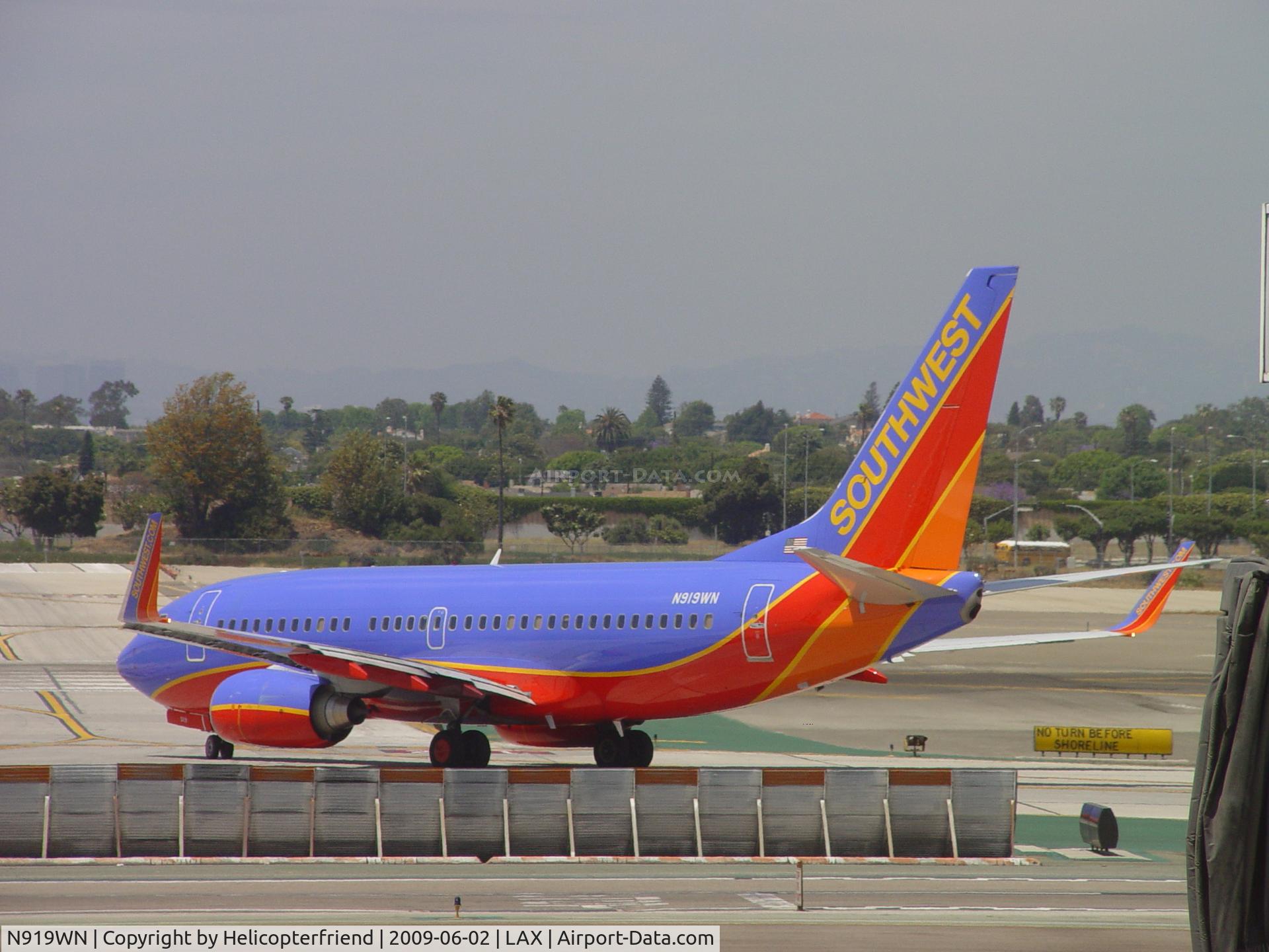 N919WN, 2008 Boeing 737-7H4 C/N 36625, Turning onto Runway 24L for take off