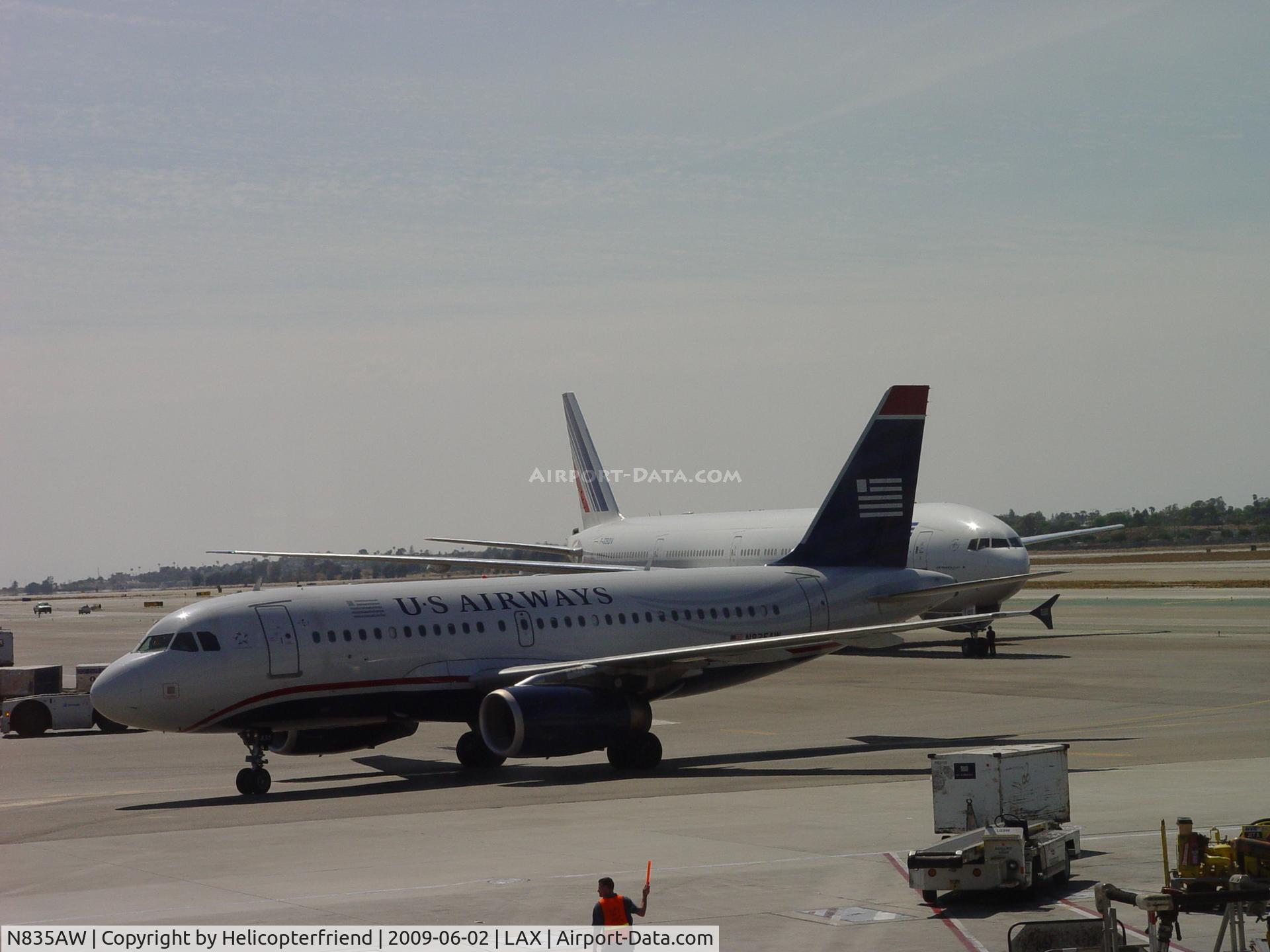 N835AW, 2005 Airbus A319-132 C/N 2458, Taxiing into the gate for unloading at Terminal 1