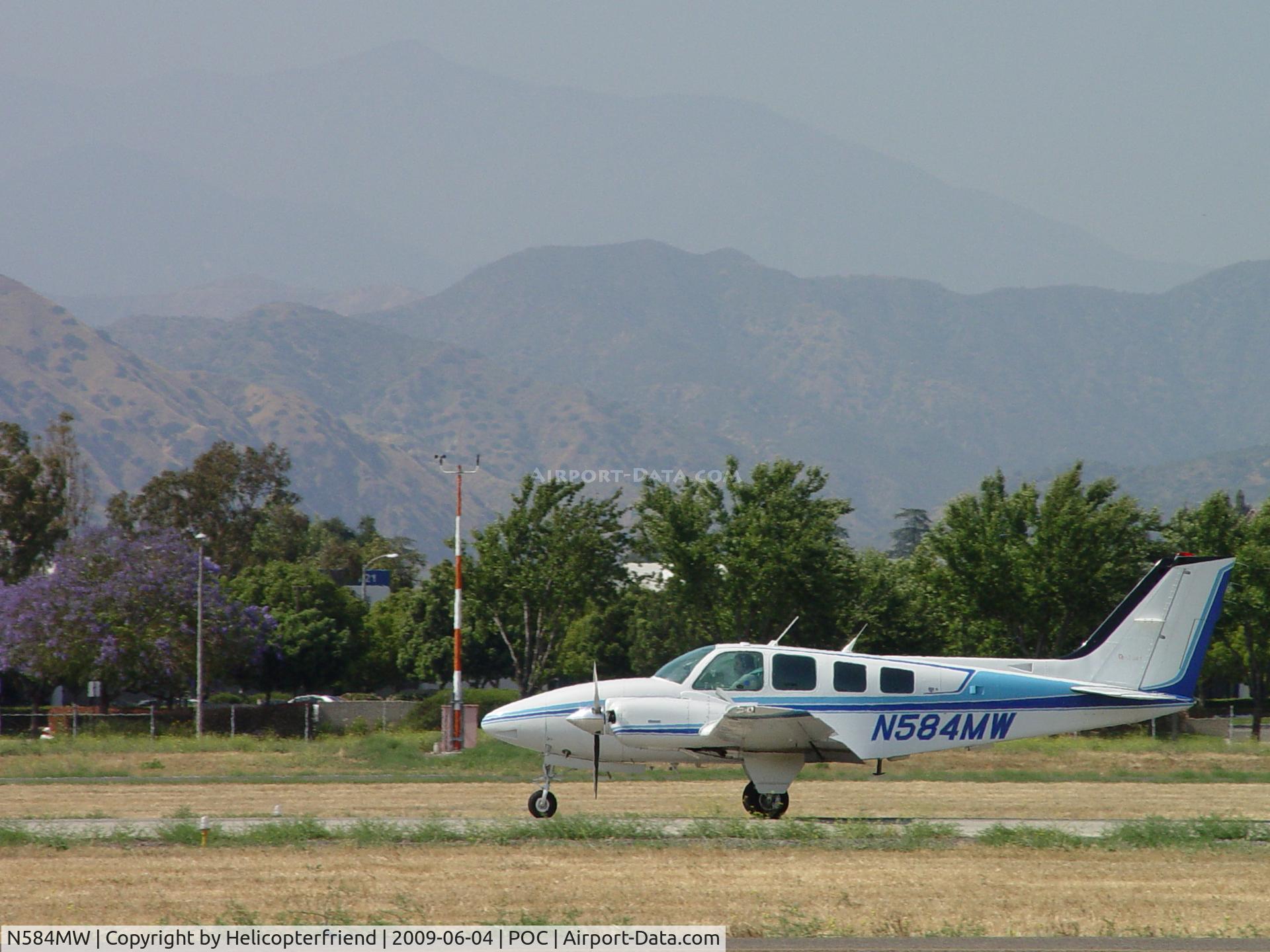 N584MW, 1991 Beech 58 Baron C/N TH-1615, Down and rolling out on 26L