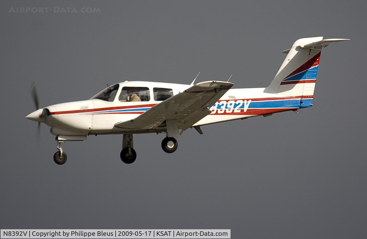 N8392V, 1981 Piper PA-28RT-201T Arrow IV C/N 28R-8131141, First picture of this Piper on short final rwy 3. In the light of the sunset sun on a dark sky.