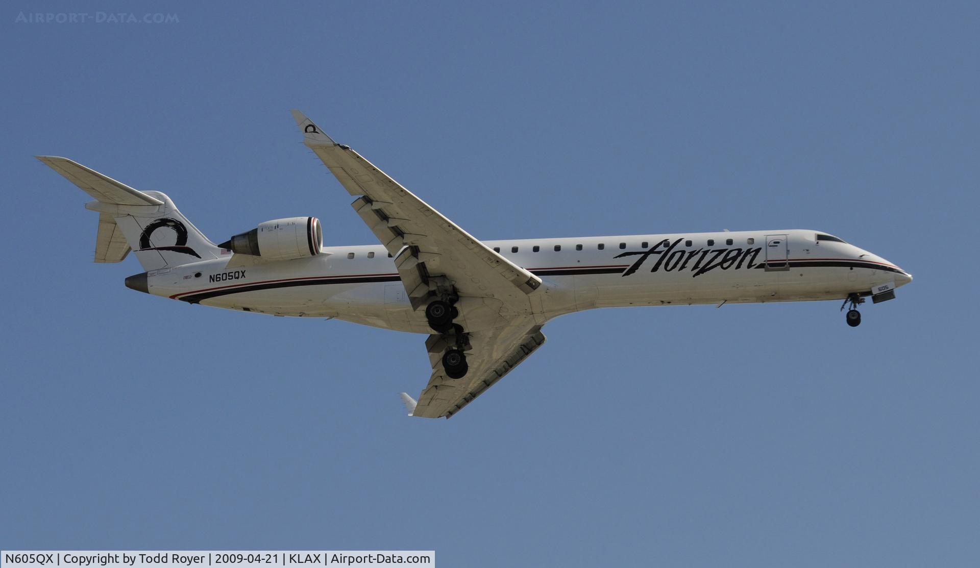 N605QX, 2002 Bombardier CRJ-701 (CL-600-2C10) Regional Jet C/N 10022, Landing 24R at LAX