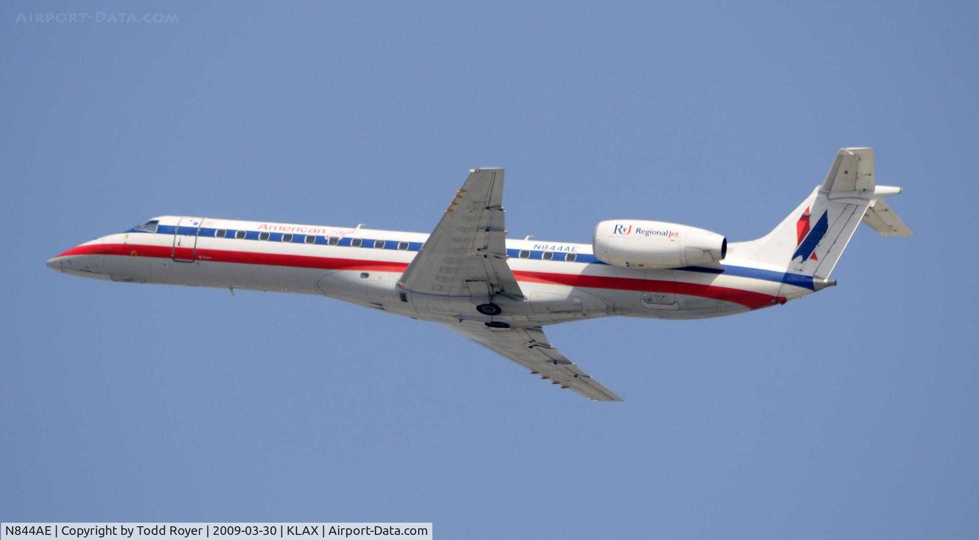 N844AE, 2003 Embraer ERJ-140LR (EMB-135KL) C/N 145682, Departing LAX on 25R