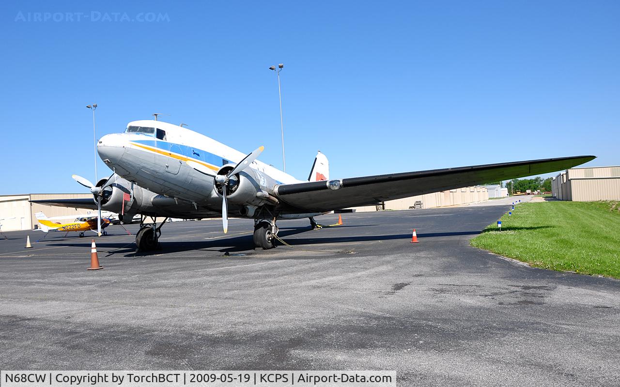 N68CW, 1943 Douglas DC-3C C/N 25980, DC3C with missing aileron and elevator on the ramp at KCPS.
