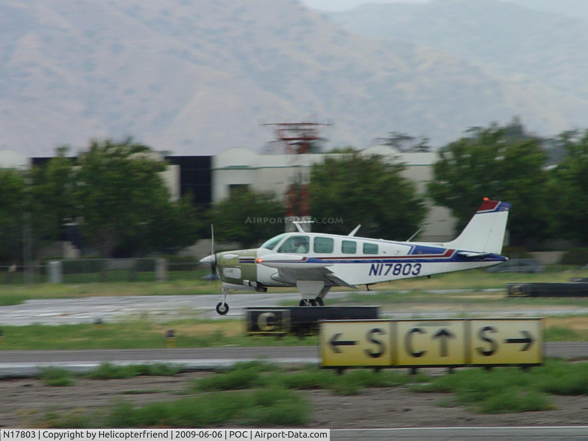 N17803, 1977 Beech A36 Bonanza 36 C/N E-1031, Rolling out on 26L on a rainy day