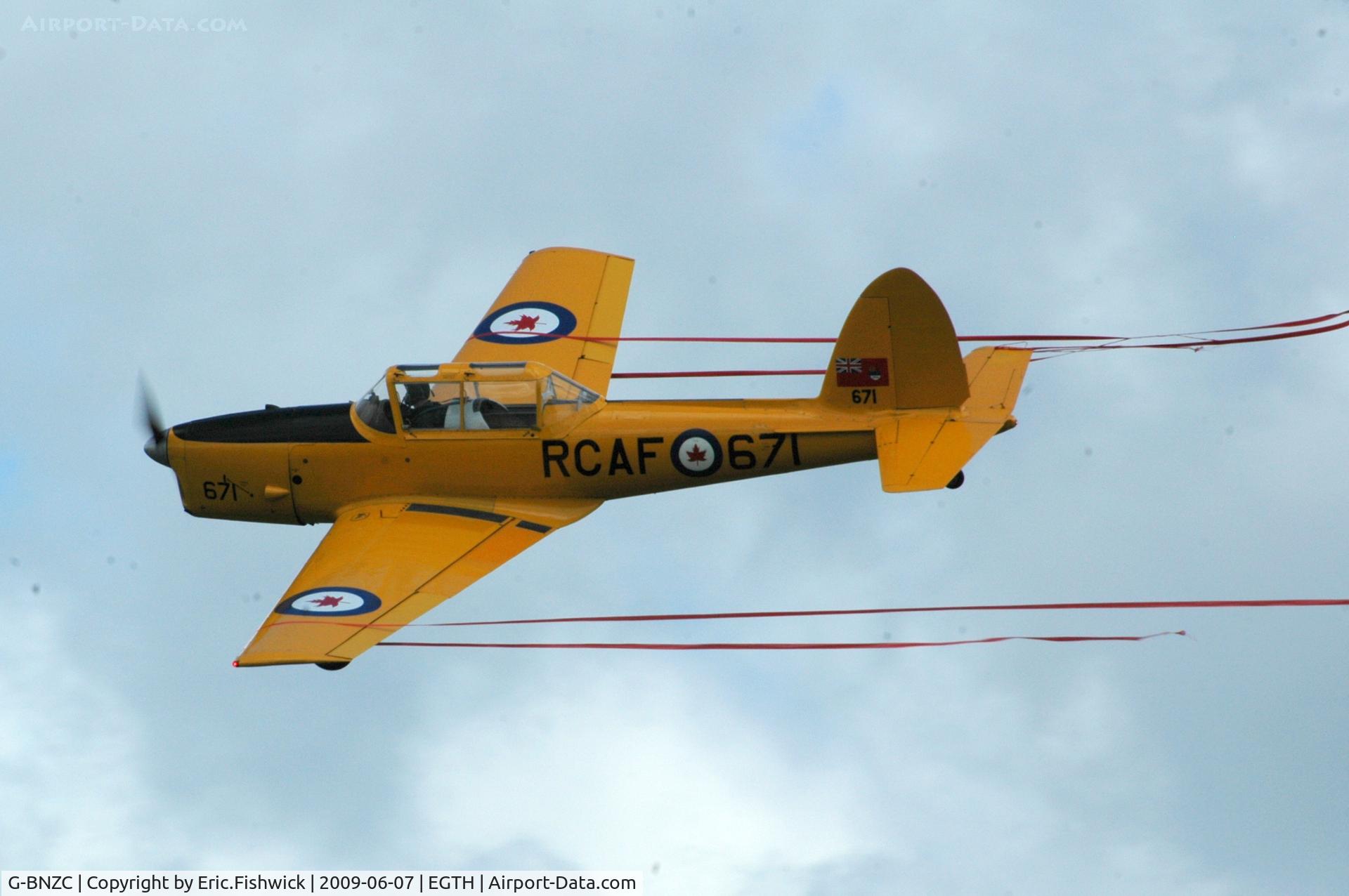G-BNZC, 1952 De Havilland DHC-1 Chipmunk 22 C/N C1/0778, 5. 671 Ribbon catching at Shuttleworth Summer Air Display