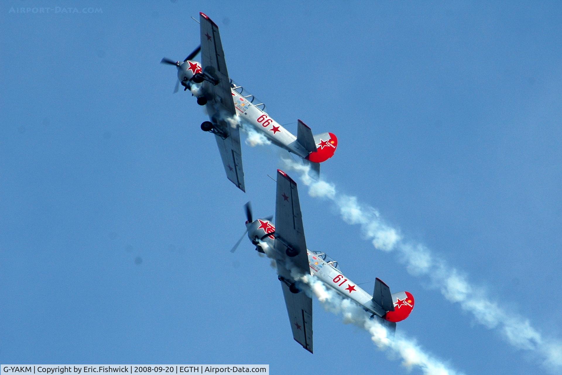 G-YAKM, 1984 Yakovlev Yak-50 C/N 842710, 5. G-YAKM and G-YAKN in very close formation at Shuttleworth Evening Air Display