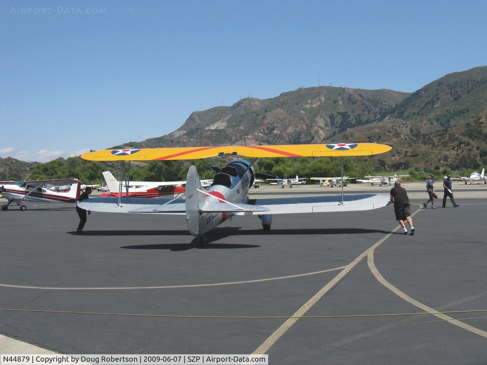 N44879, 1940 Naval Aircraft Factory N3N-3 C/N 4425, 1940 Naval Aircraft Factory N3N-3 'Yellow Peril', Lycoming R680 300 Hp upgrade, this historic aircraft has been sold to the El Toro Marine Corps Museum, respotting temporarily-selling owner at left wing