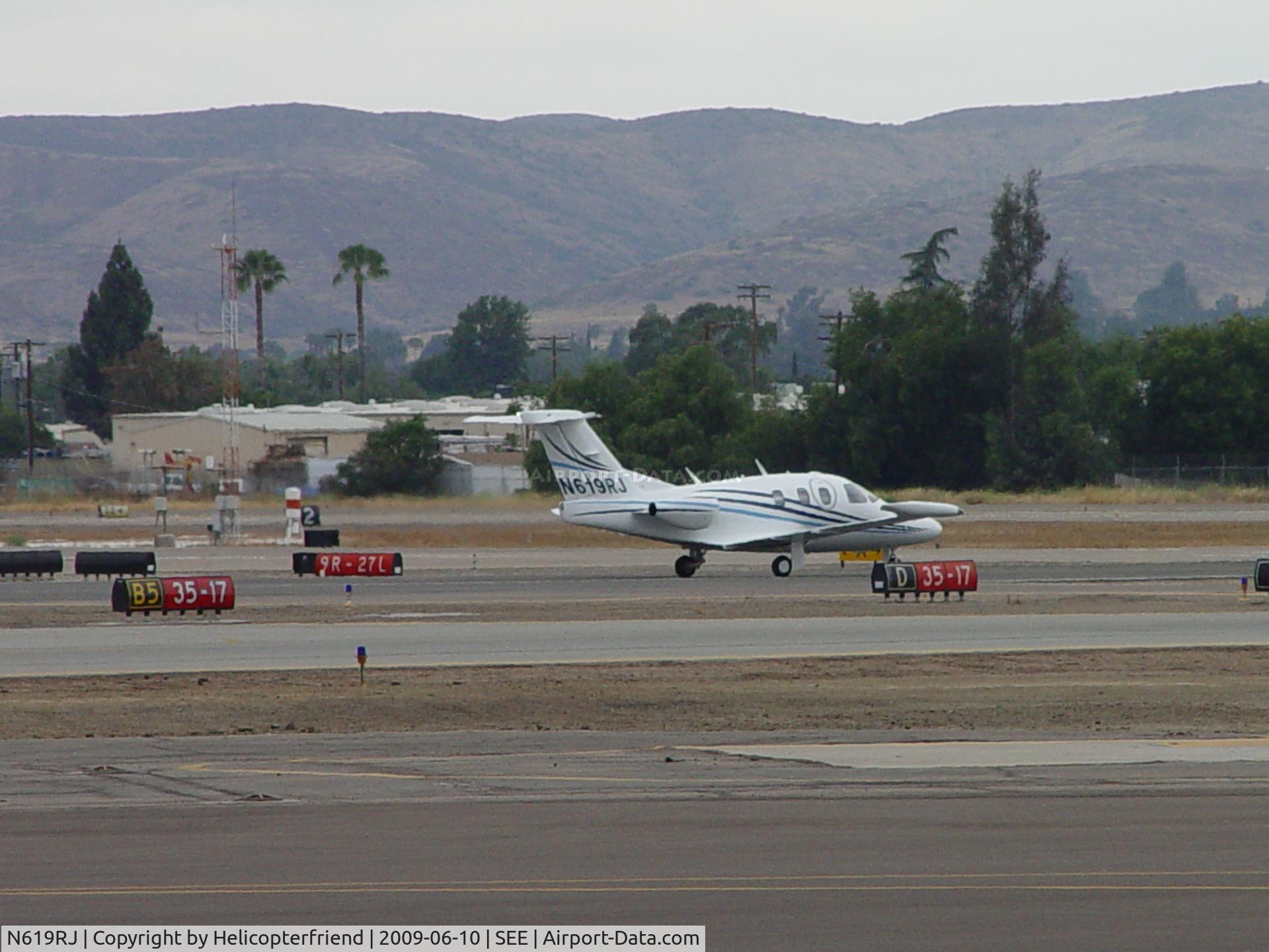 N619RJ, 2008 Eclipse Aviation Corp EA500 C/N 000231, Waiting to cross active runways returning to Jet Air area