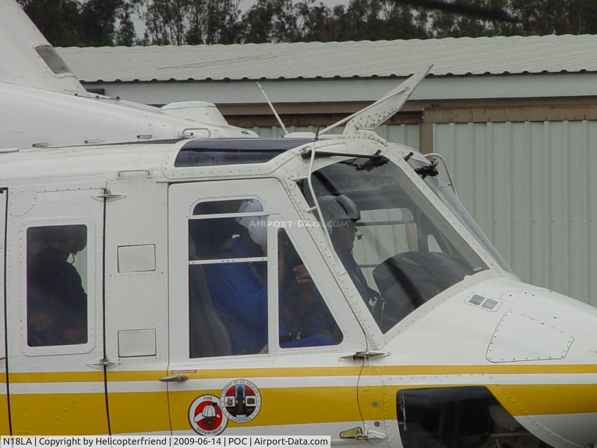 N18LA, 1992 Bell 412 C/N 36043, All three crew members allowing ship to warm up, and preparing for a mission