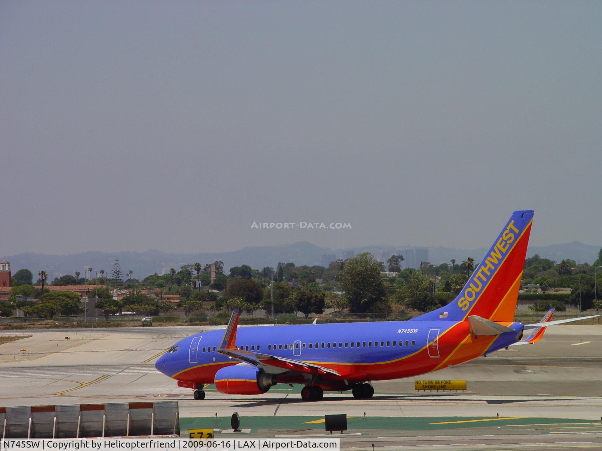N745SW, 1999 Boeing 737-7H4 C/N 29491, Taxiing to 24L for take off