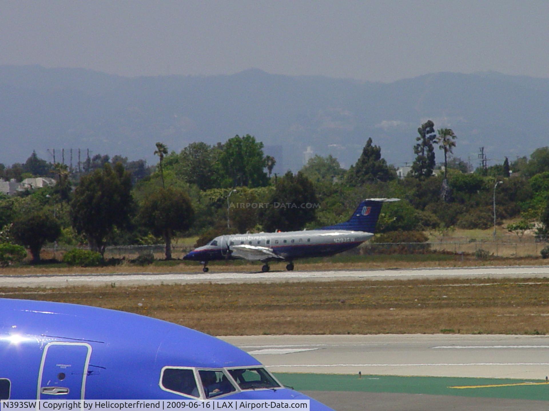 N393SW, 1997 Embraer EMB-120ER C/N 120.330, Taking off westbound on 24R