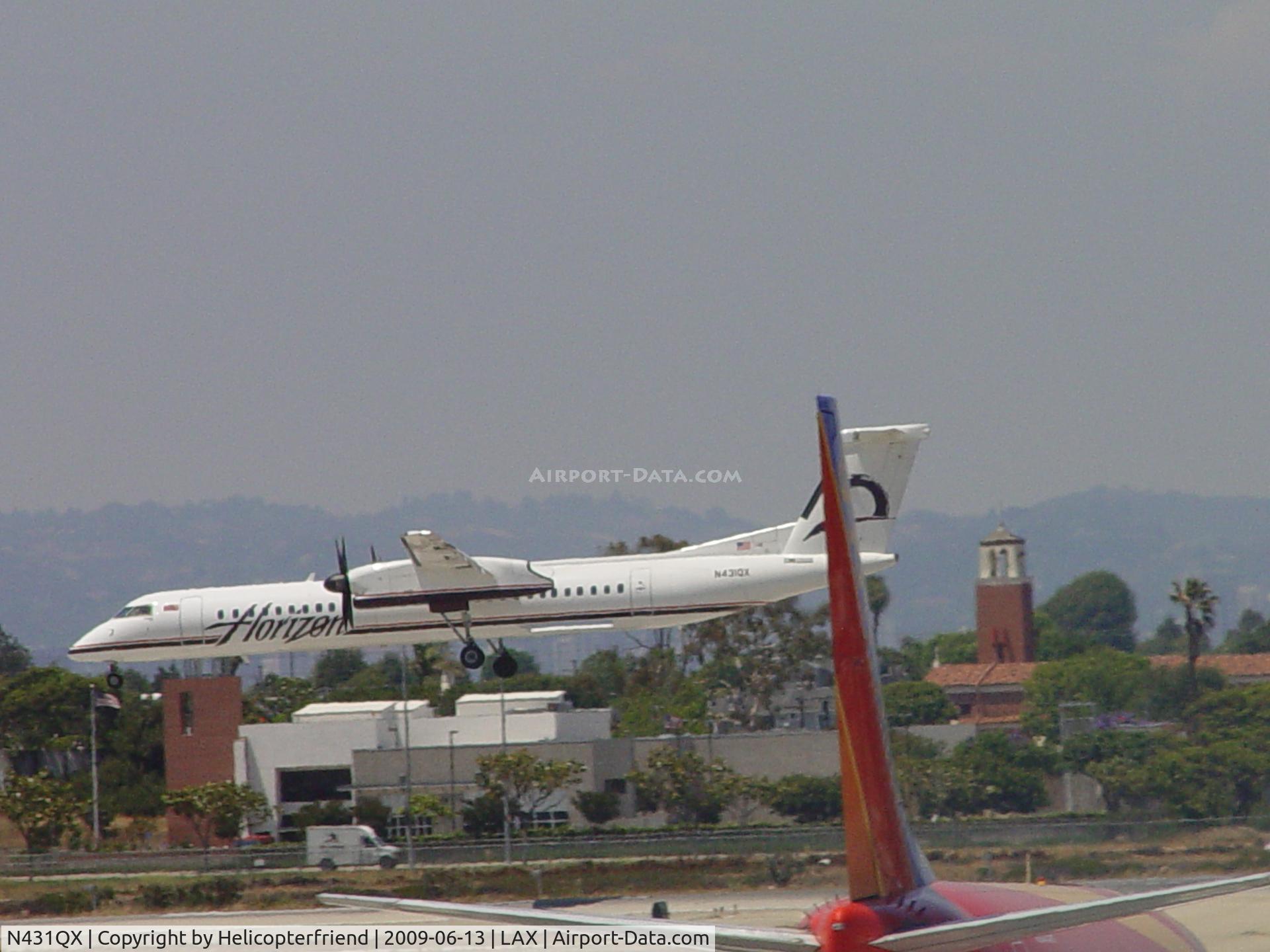 N431QX, 2007 Bombardier DHC-8-402 Dash 8 C/N 4164, Landing 24R