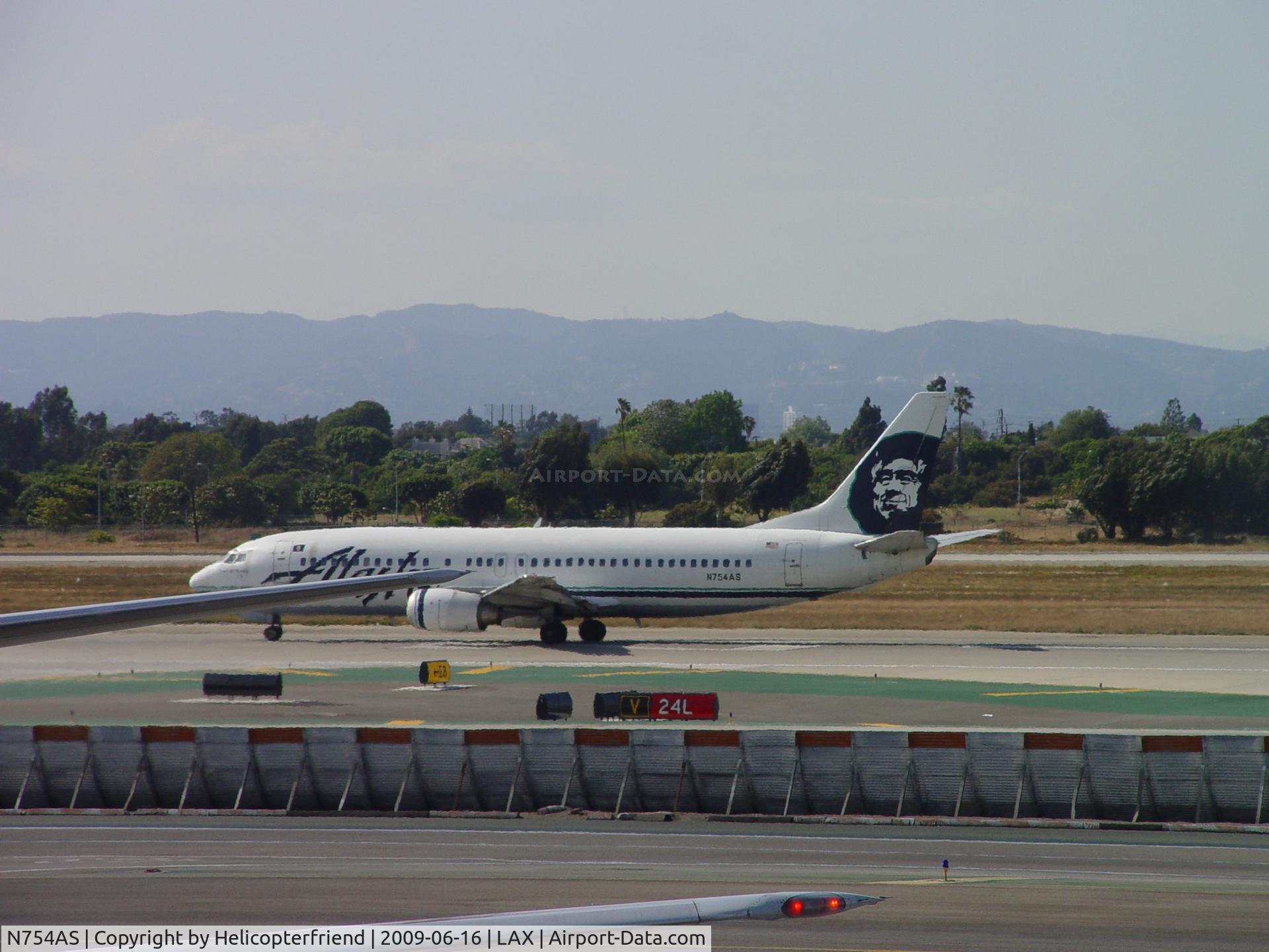 N754AS, 1992 Boeing 737-4Q8 C/N 25095, Taking off westbound on 24L