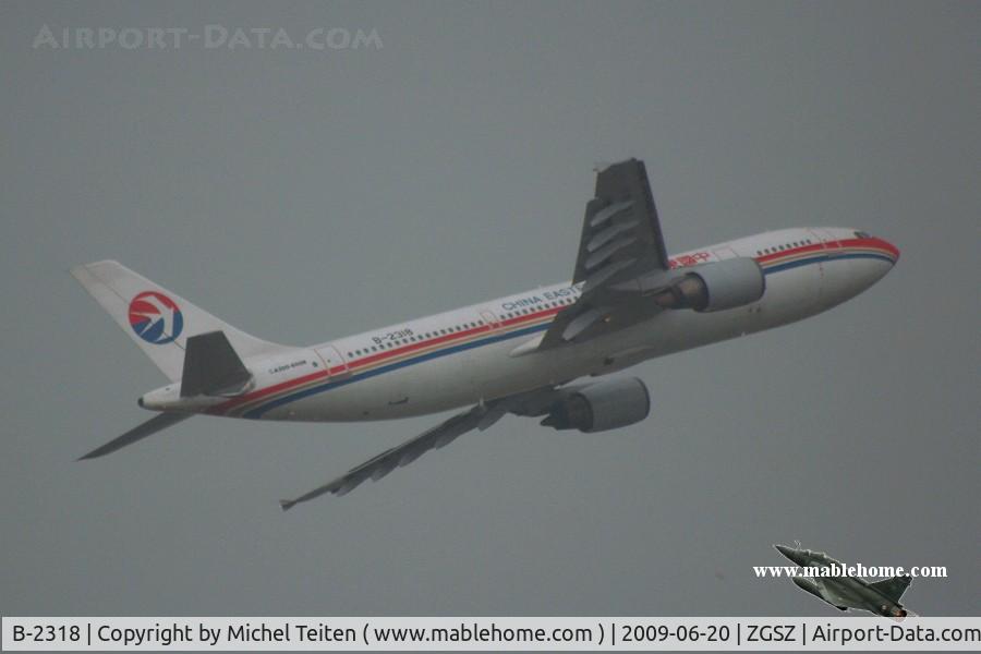 B-2318, 1993 Airbus A300B4-605R C/N 707, China Eastern Airlines taking off during a summer thunderstorm