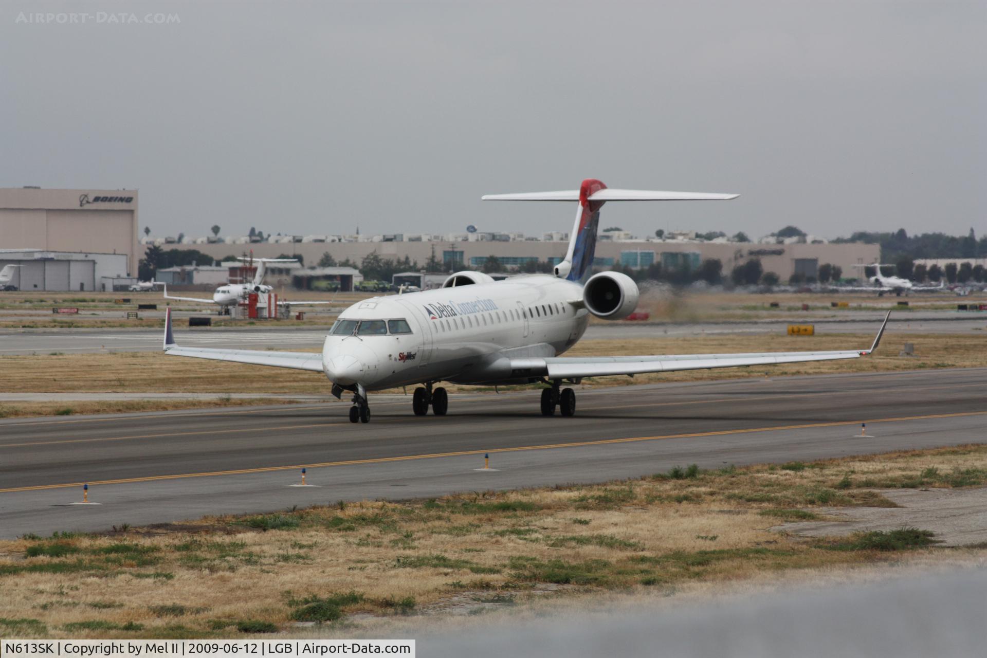 N613SK, 2002 Bombardier CRJ-701 (CL-600-2C10) Regional Jet C/N 10038, SKW4718 - LGB-SLC - Taxiing For Departure RWY 30
