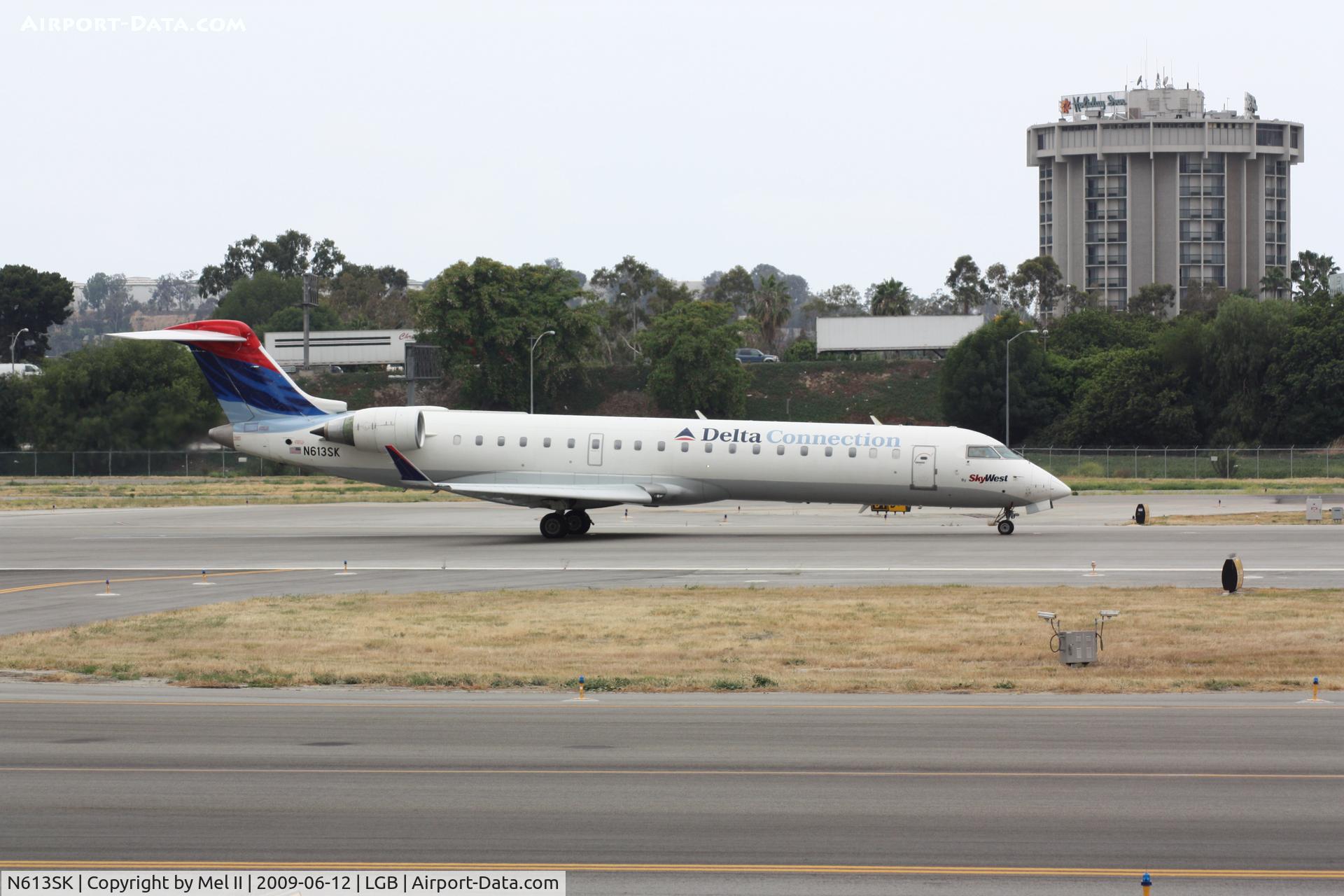 N613SK, 2002 Bombardier CRJ-701 (CL-600-2C10) Regional Jet C/N 10038, SKW4718 - LGB-SLC - Departing RWY 30